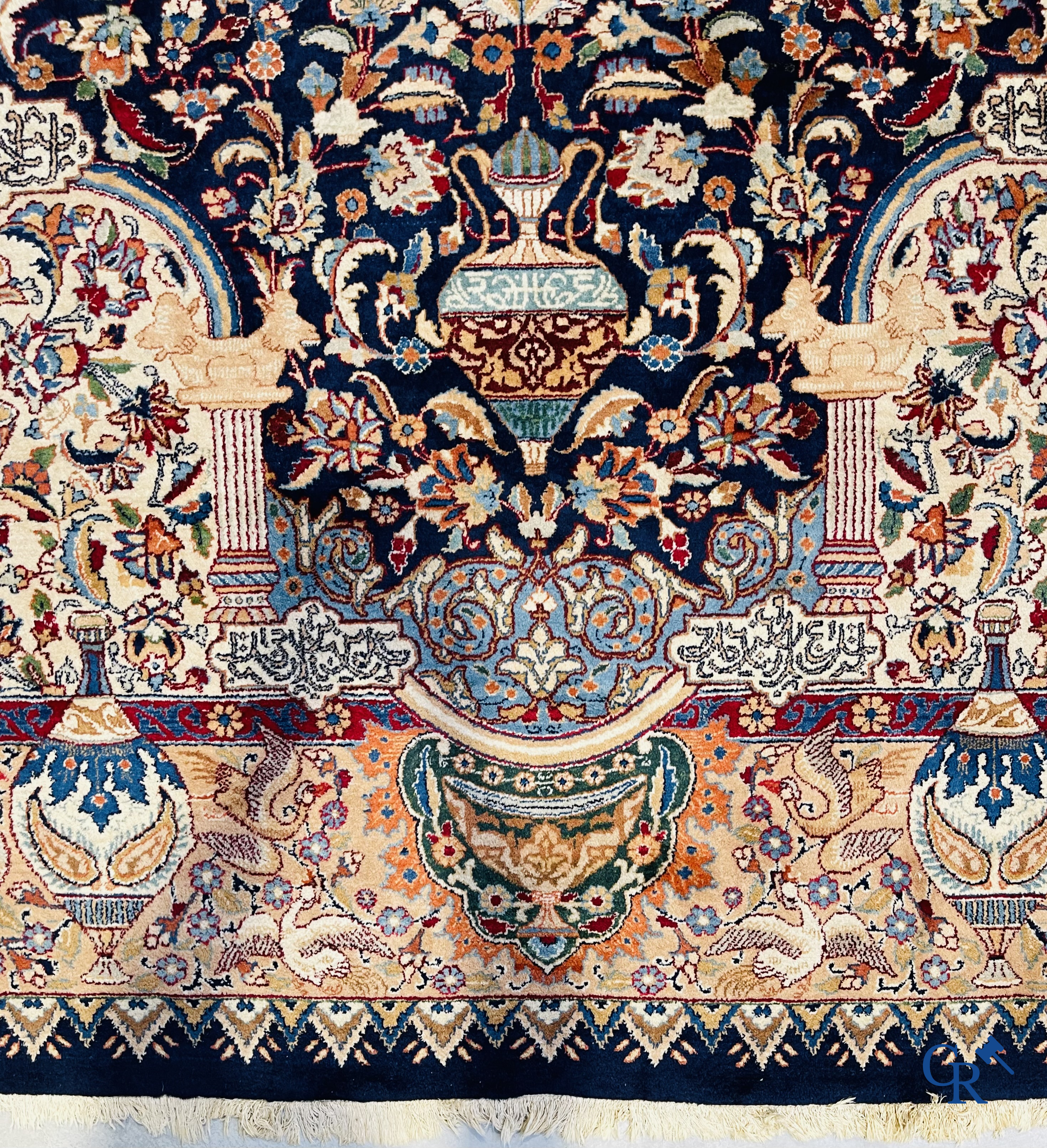 Oriental carpets: A large hand-knotted oriental carpet with antique decor. Multiple inscriptions.