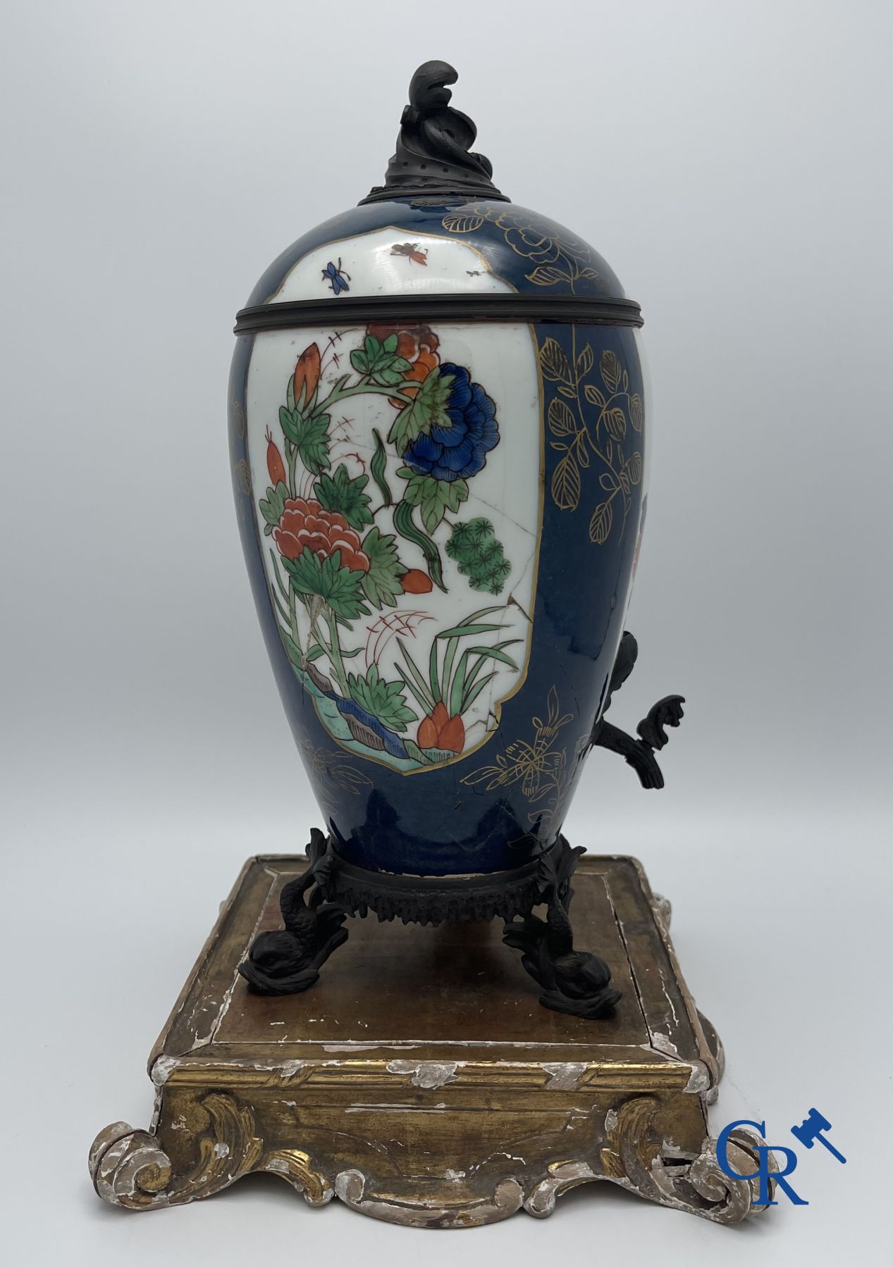 A porcelain table fountain with bronze fittings.