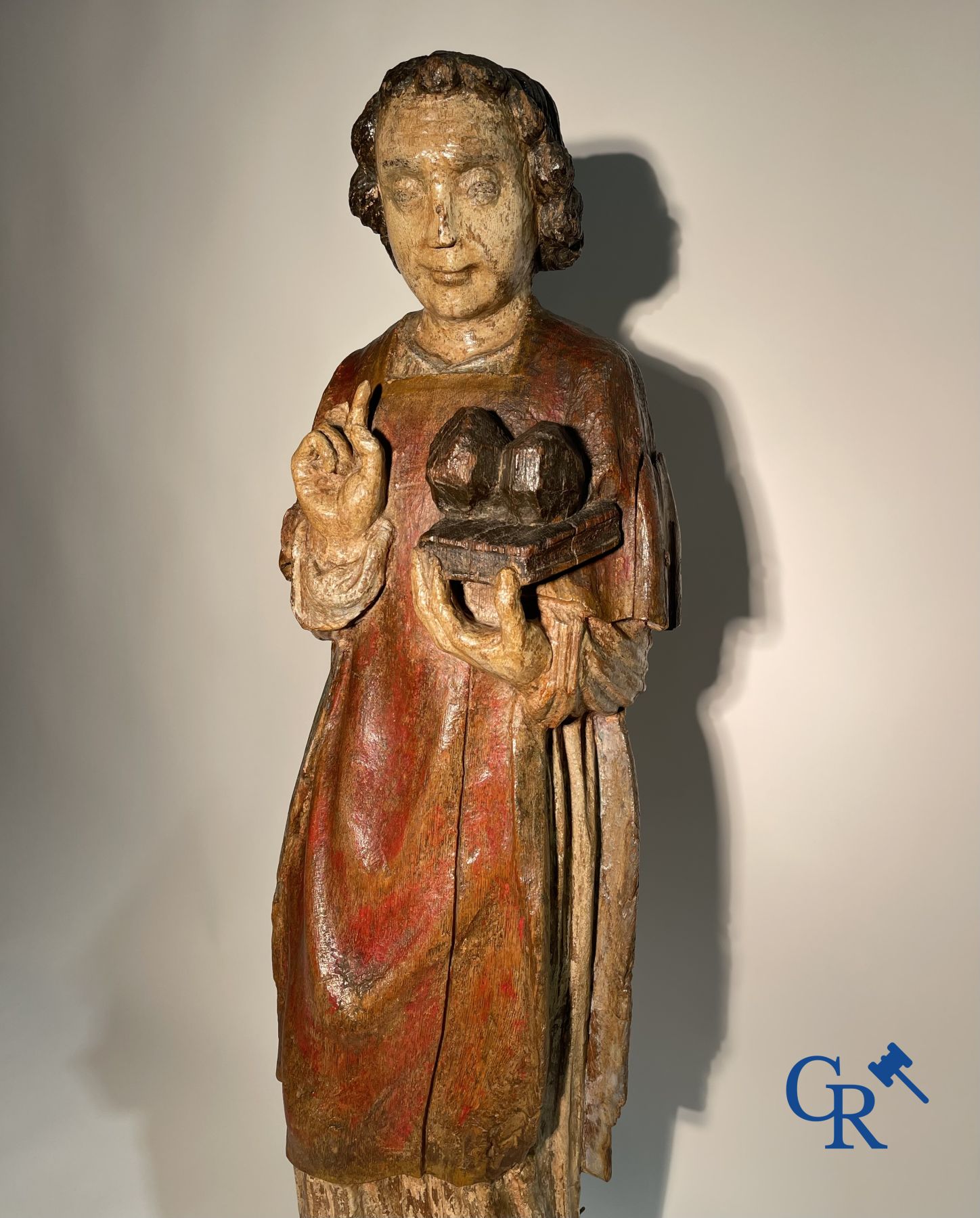 Wooden sculpture: Polychrome wood sculpture of a saint. Saint Stephen. Probably 17th century.