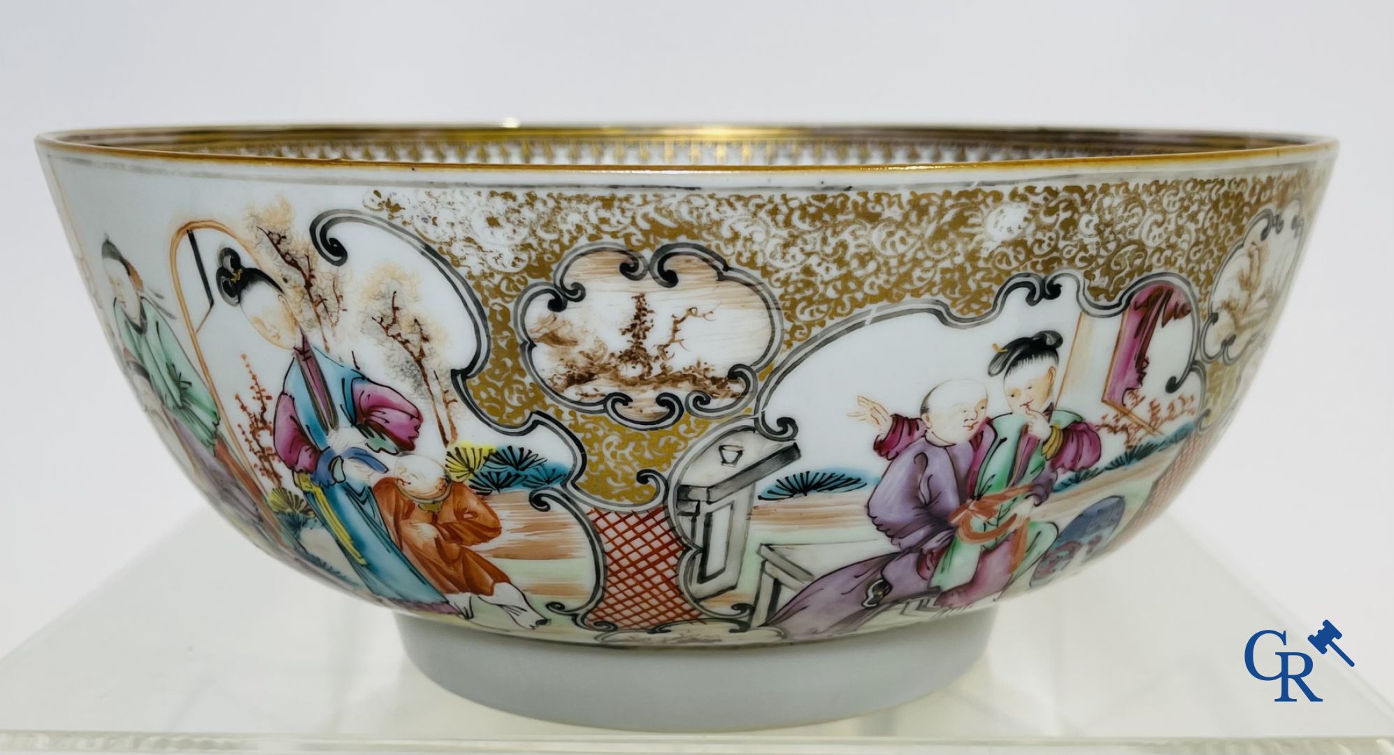 A large Chinese famille rose mandarin bowl, a famille rose cup and saucer and a figurine in blanc de chine.