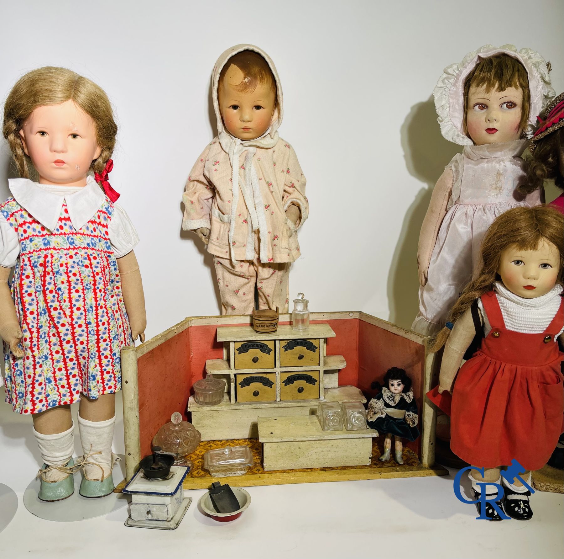 Toys: antique dolls: a lot of 6 dolls with a miniature grocery store attached.