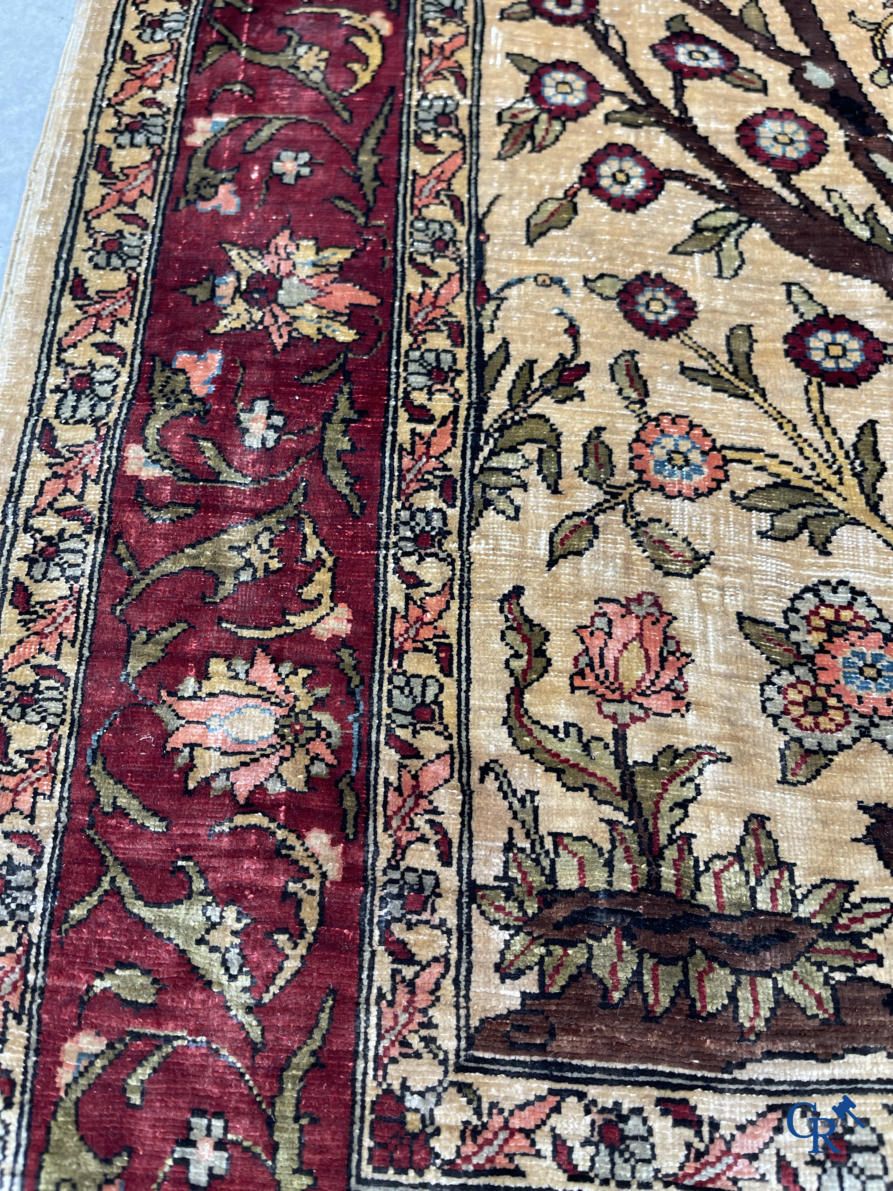 Oriental carpets, Hereke, a finely hand-knotted and signed silk carpet with a tree of life.