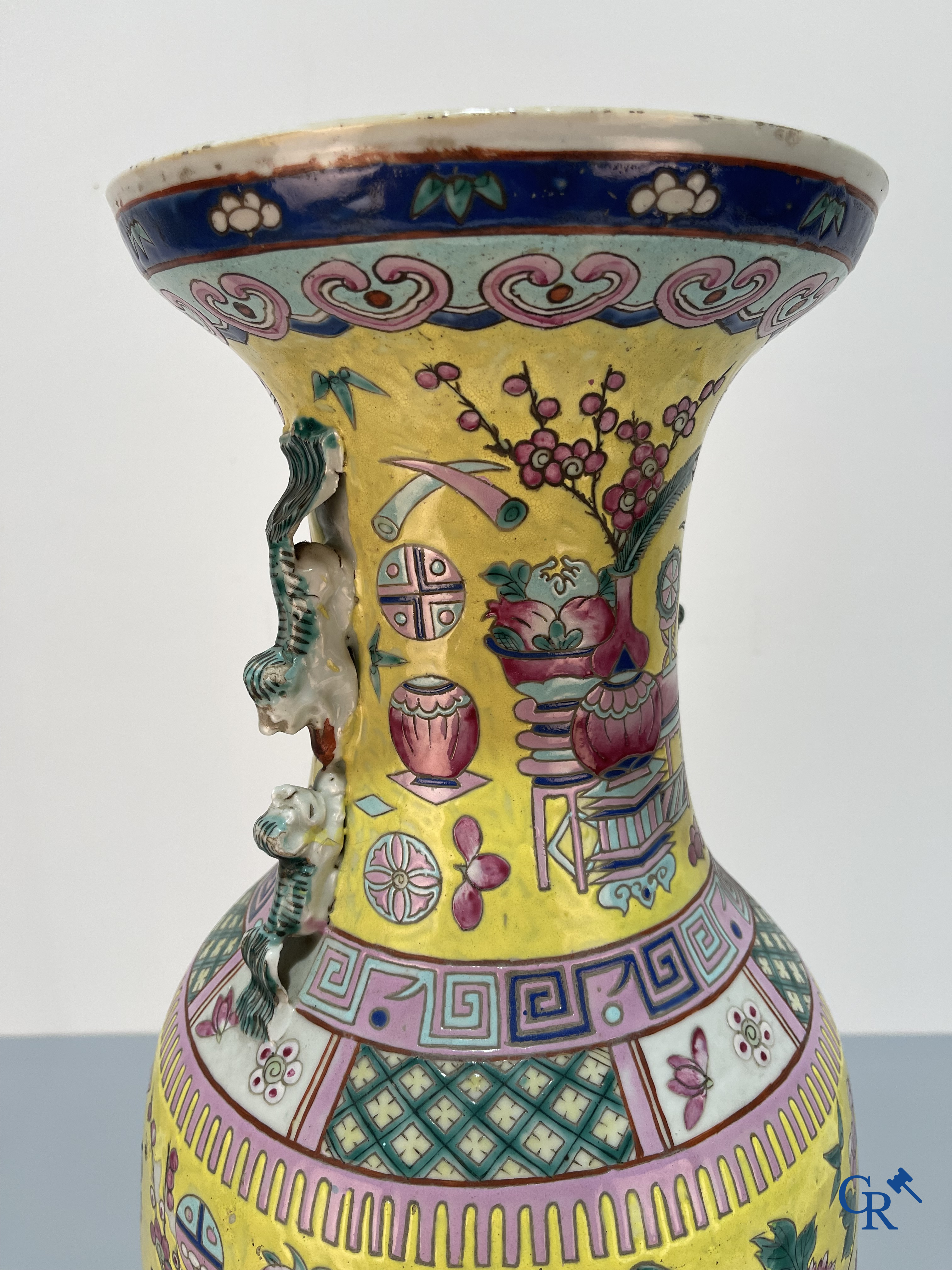 Asian Art, Chinese porcelain, a large Chinese famille jaune and rose vase with a decor of antiques. 19th century.