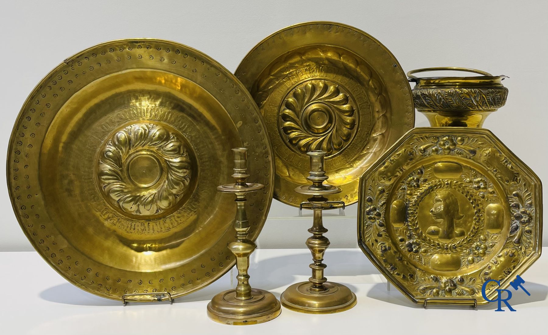 A lot of 2 large baptismal dishes, a portrait dish, 2 candlesticks and a holy water bucket. 16th-17th century.