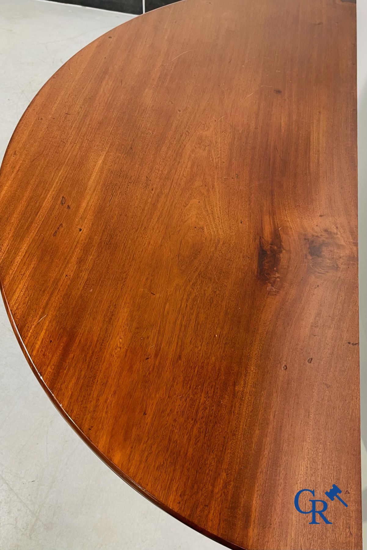 Furniture: fold-out crescent-shaped mahogany table. Directoire period.