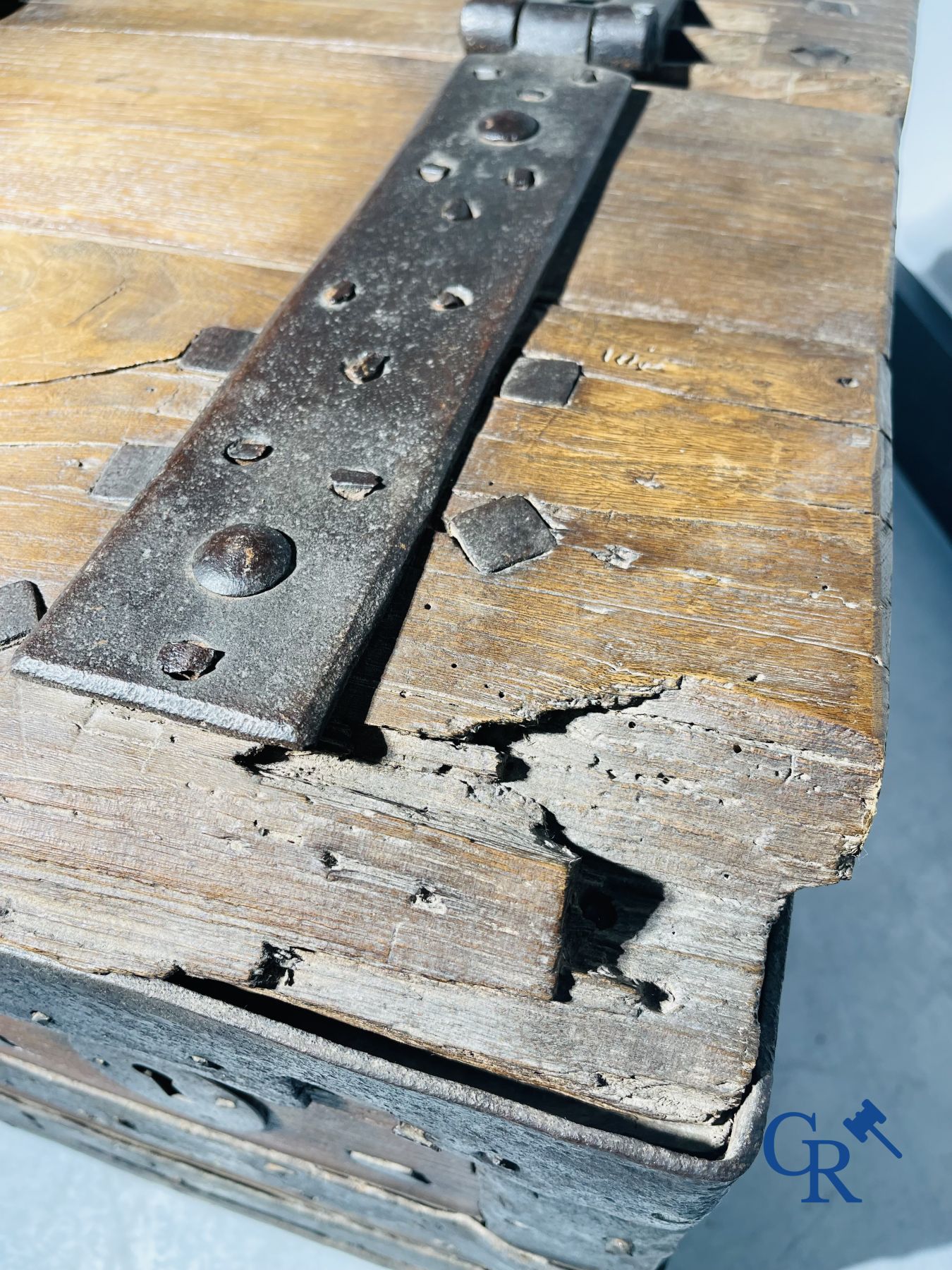 Antique wooden chest with hardware and lockwork in forging.