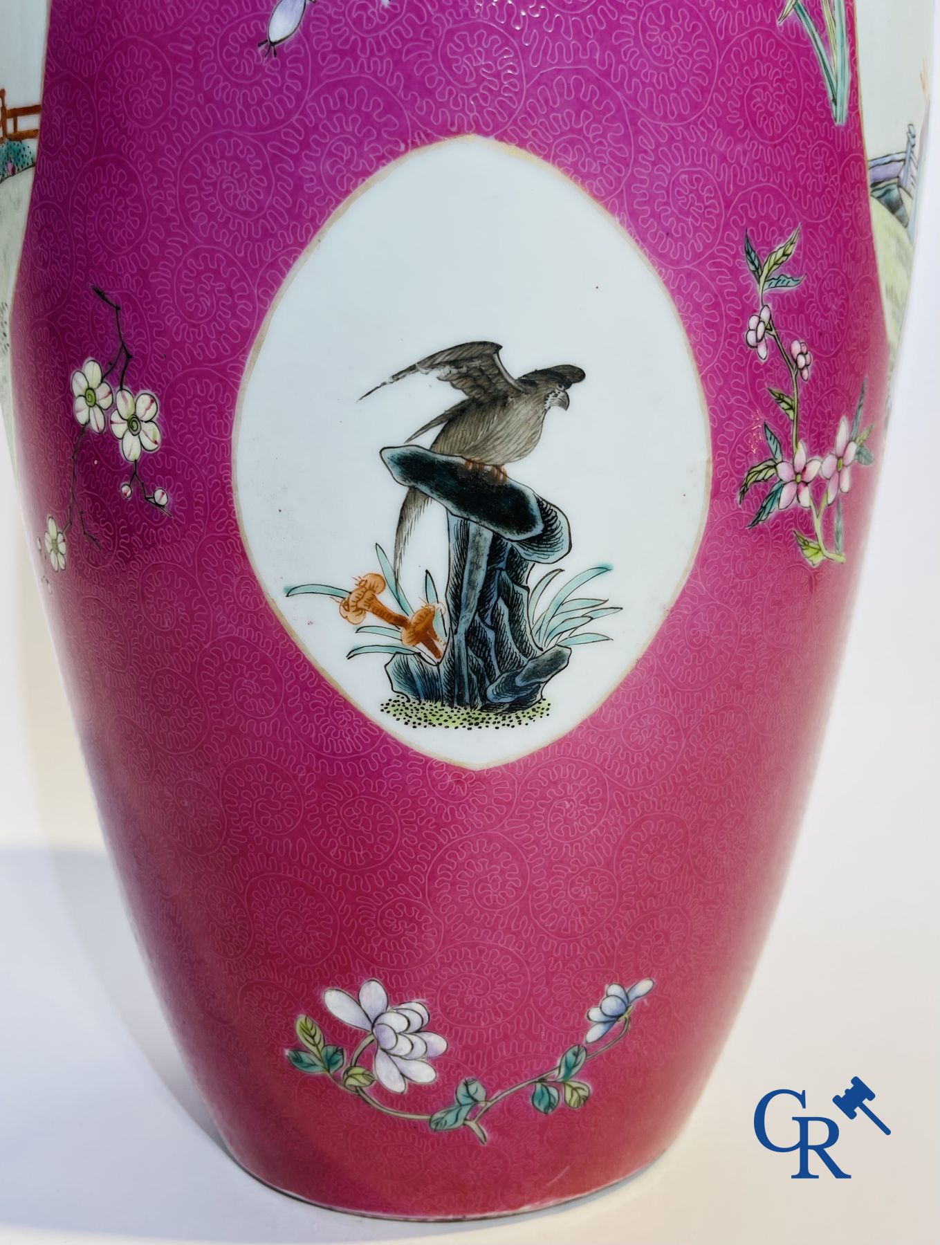 Chinese porcelain: A fine famille rose vase decorated on a red ruby background in sgraffito technique.