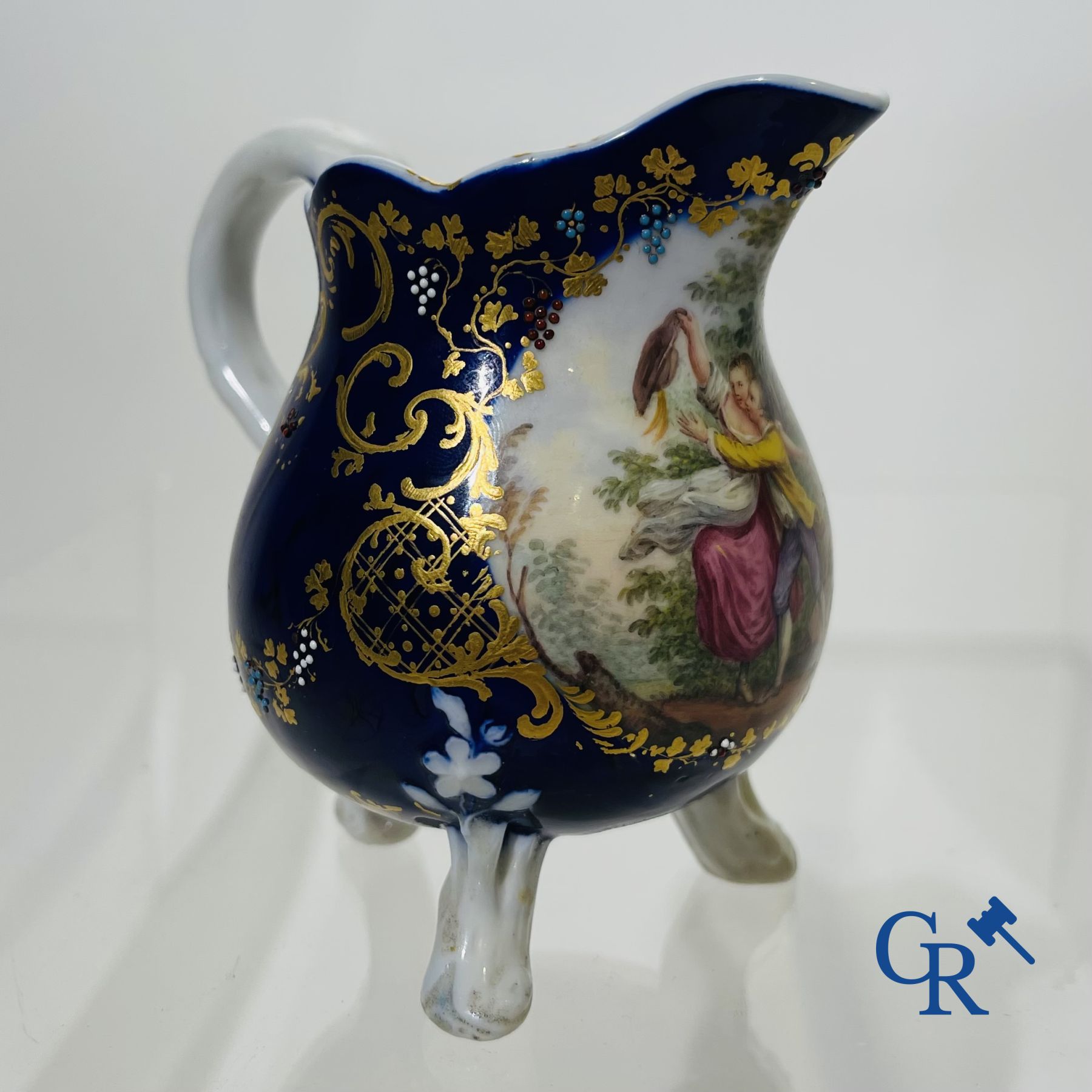 Vincennes 18th century. A three-legged milk jug in soft porcelain with lapis blue background.