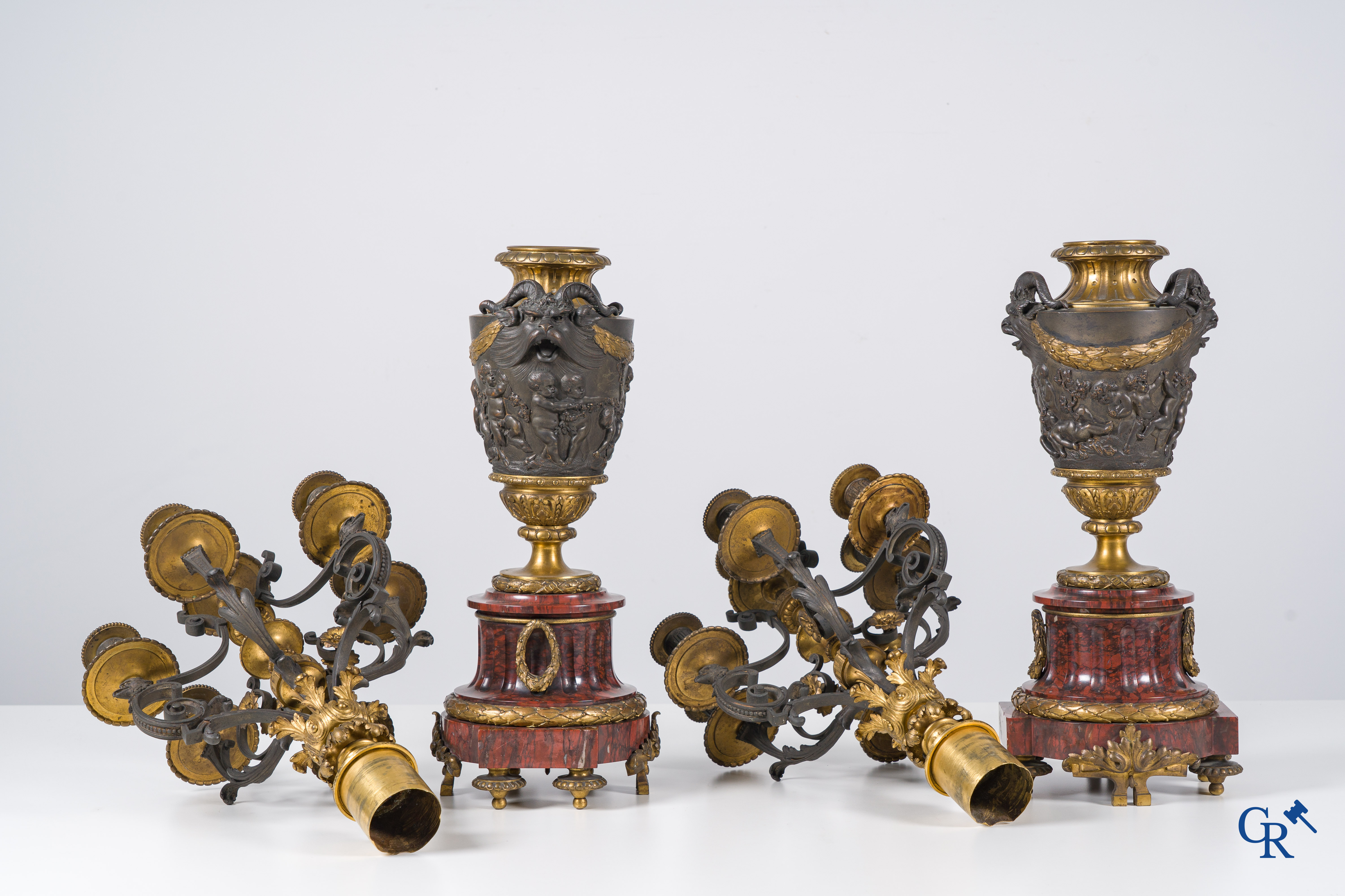 Charpentier à Paris, An imposing 3-piece fireplace clockset in gilded and patinated bronze. Late 19th century.