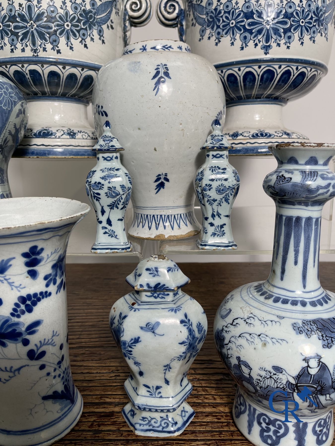 Delft: 11 pieces of blue and white faience with different décors. 17th - 18th century.