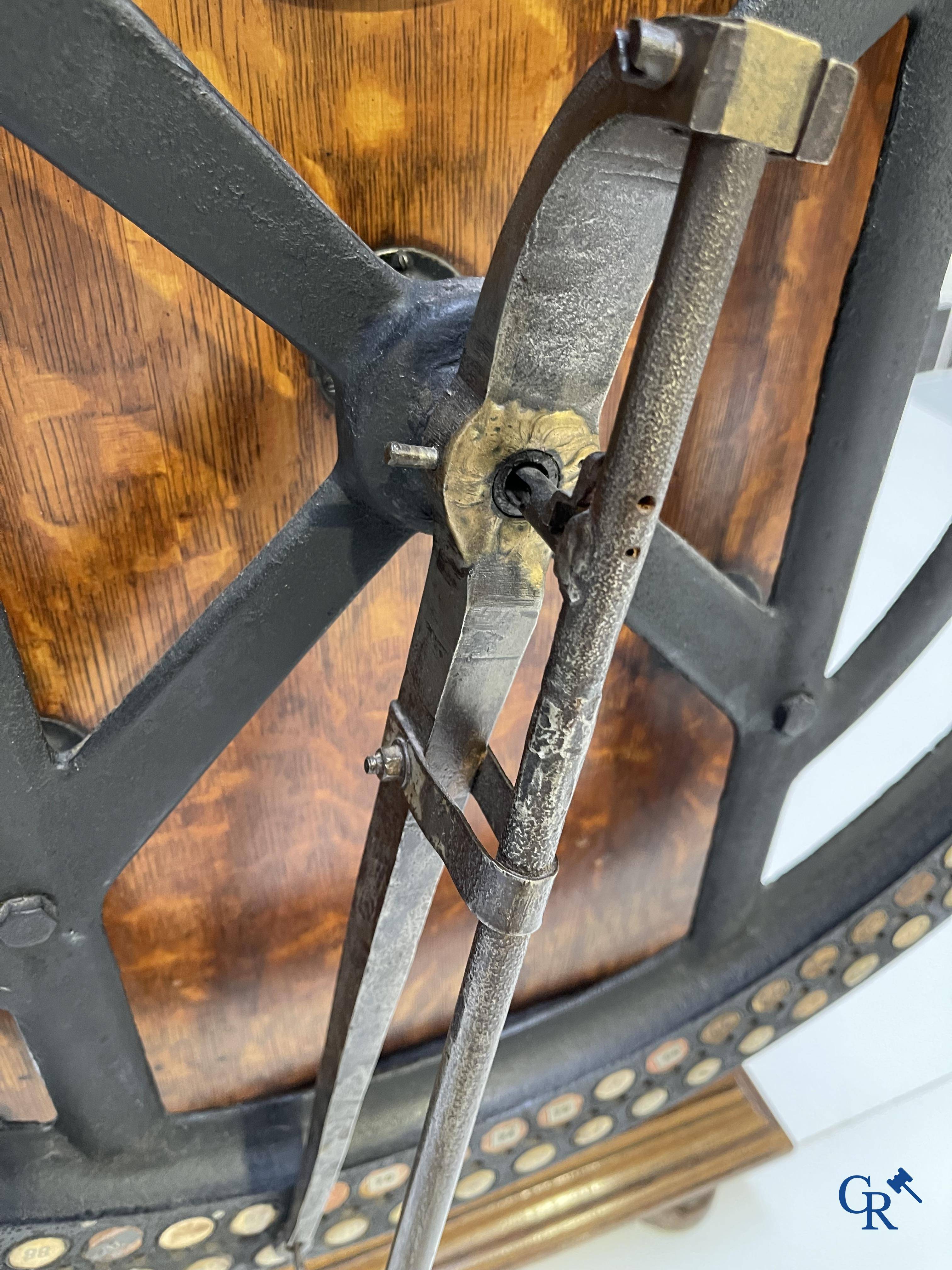 "International" Watson Business Machines Corporation of Belgium. A time clock with cast iron wheel. Circa 1900.