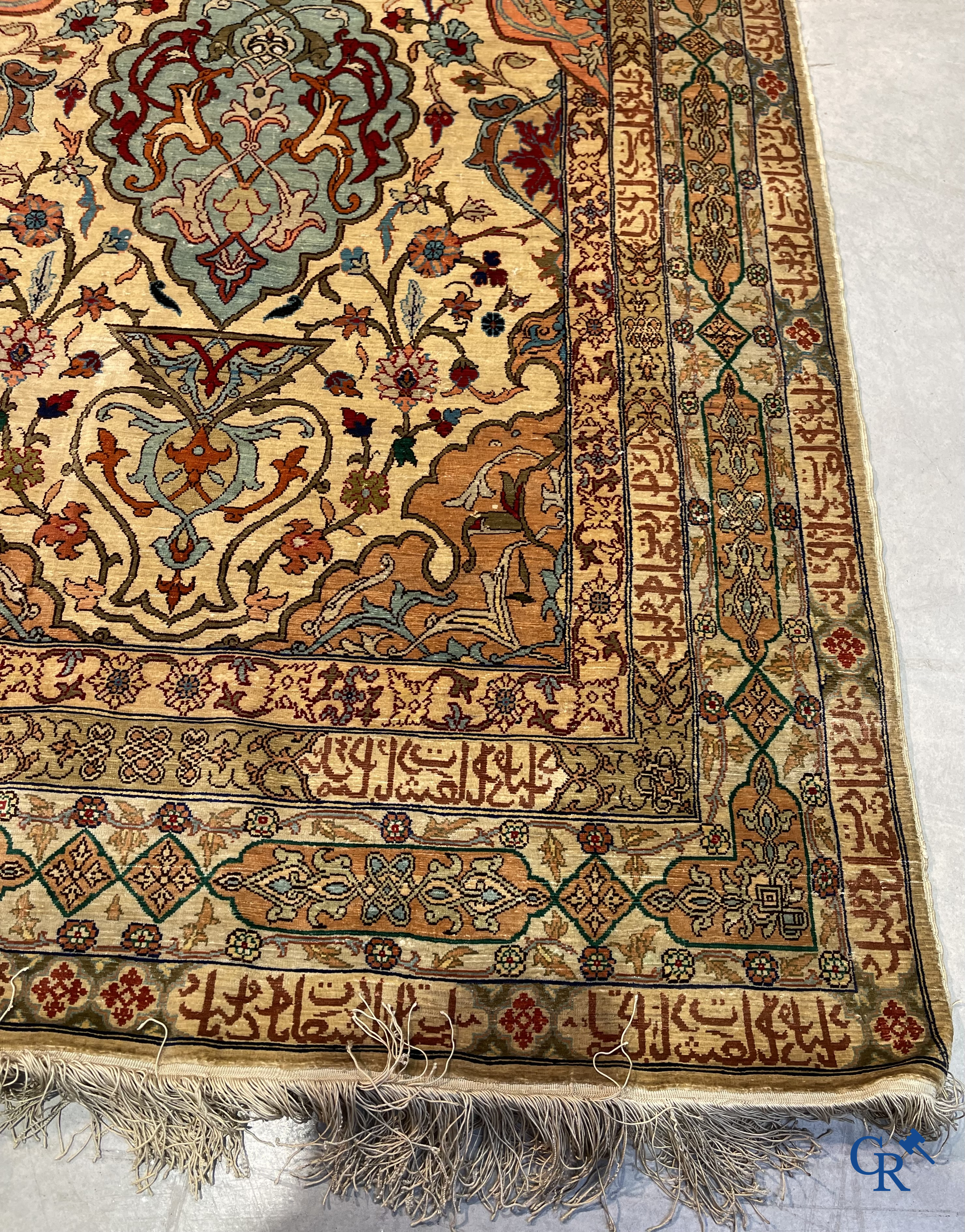 Oriental carpets, Hereke Turkey, a finely hand-knotted silk carpet with inscriptions and gold thread.