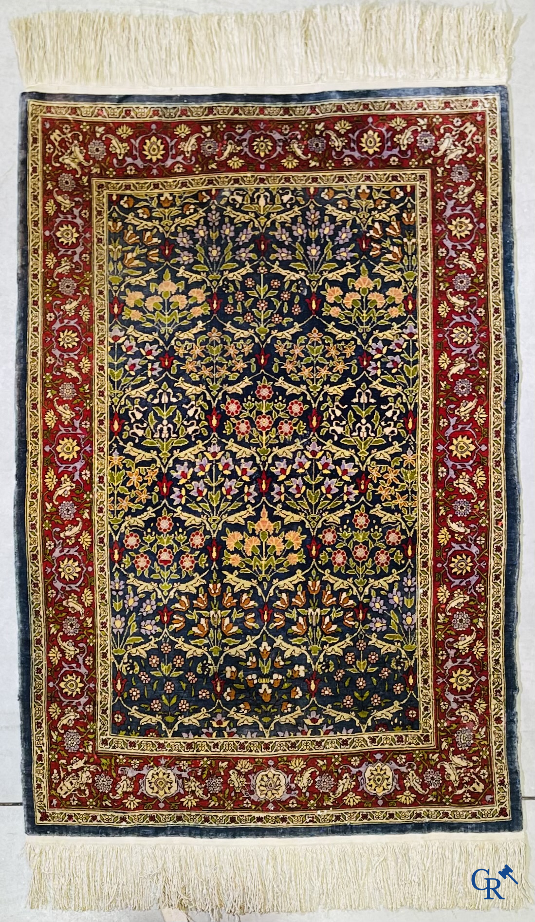 Oriental carpets, a finely hand-knotted silk carpet with floral decor.