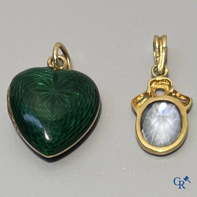 A green enamelled pendant with diamonds in gold 585°/00, and a pendant in gold 750°/00 with an aquamarine.