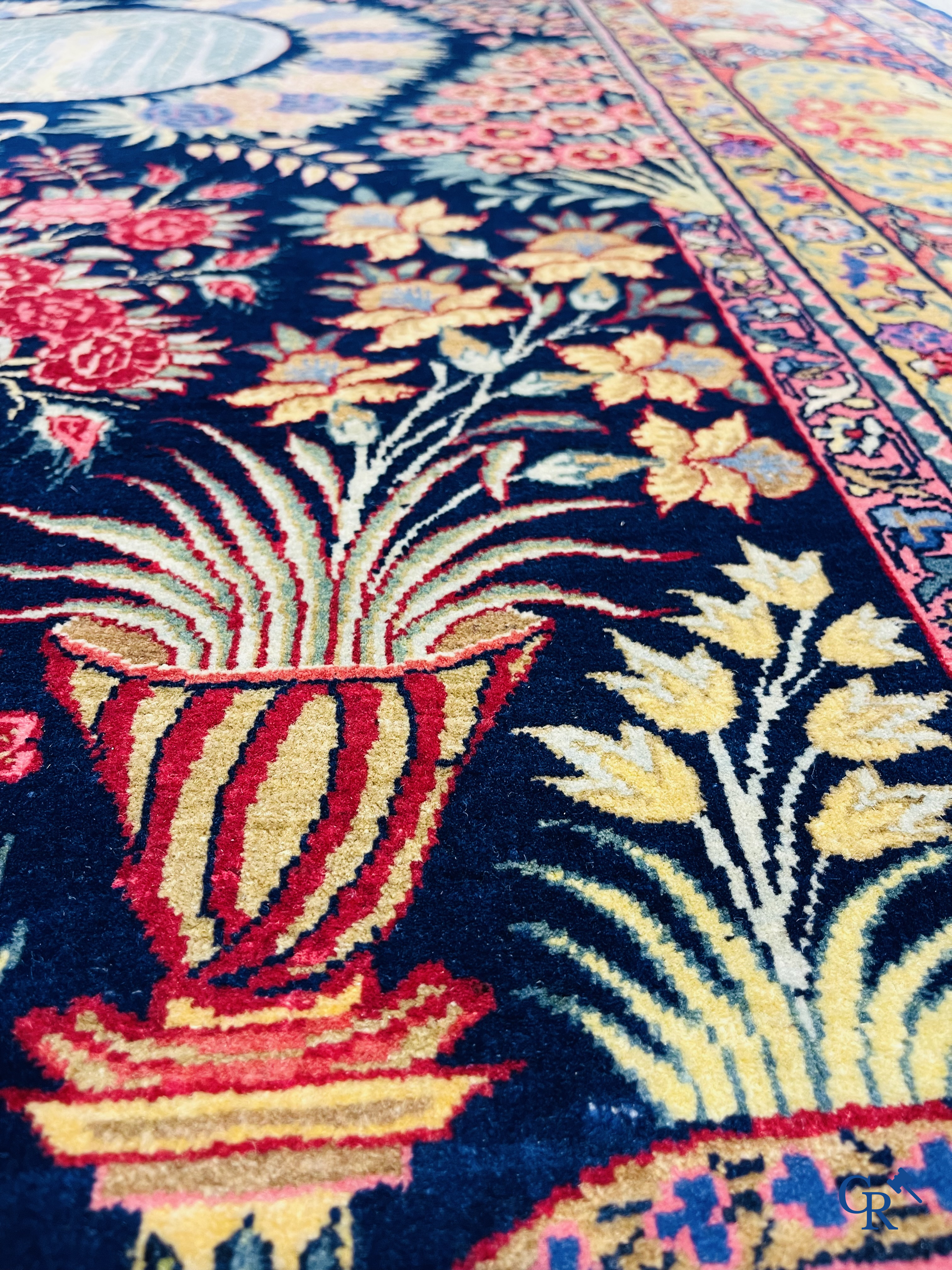 Oriental carpets: A finely knotted Oriental carpet with floral decor. Signed.