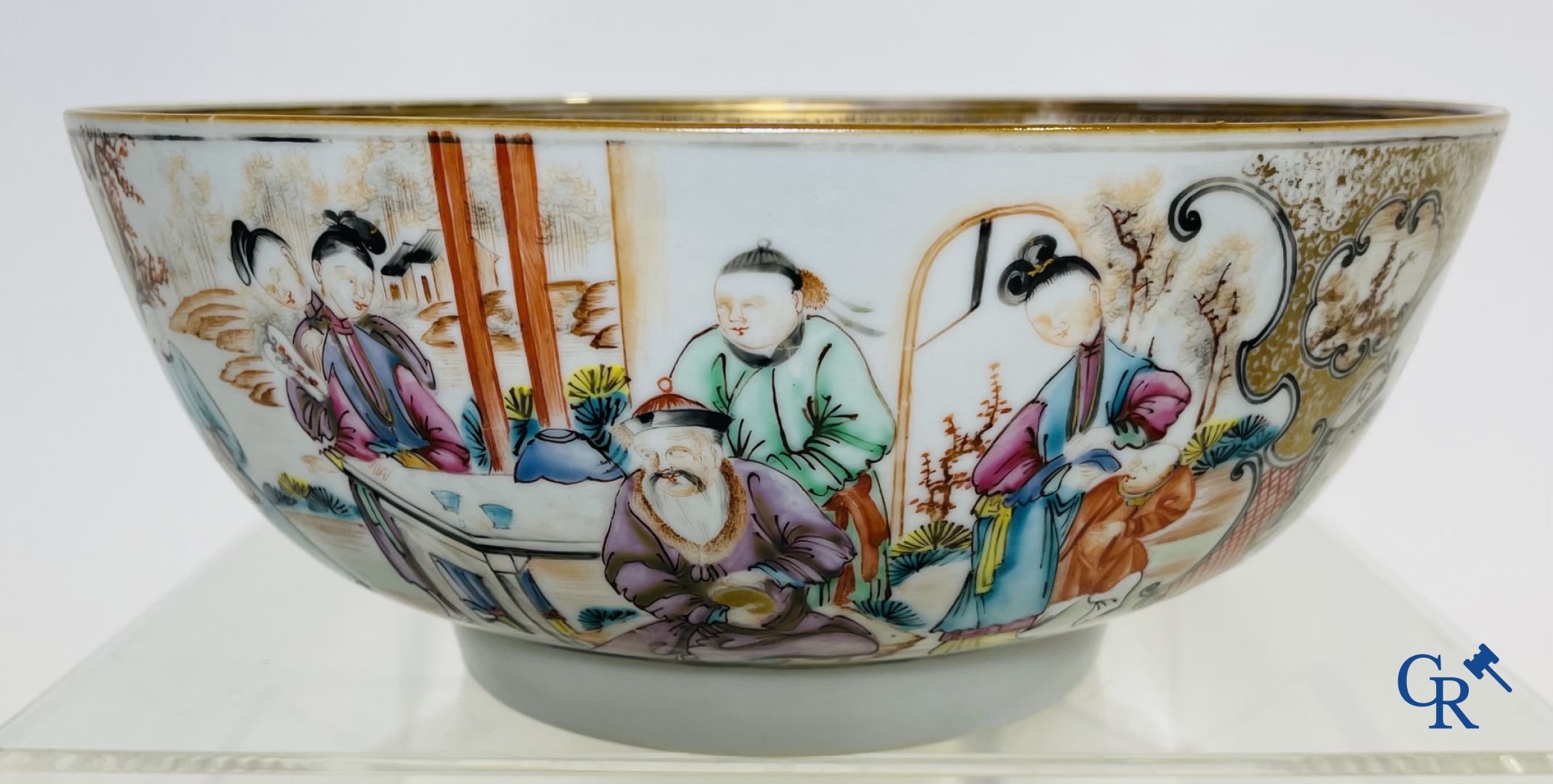 Un grand bol chinois decor mandarin en famille rose, une tasse et soucoupe en famille rose et une figurine en blanc de chine.