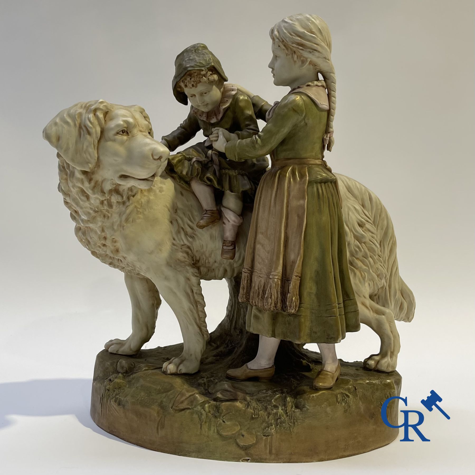 Porcelain: Royal Dux. A polychrome representation of a Saint Bernard dog with children.