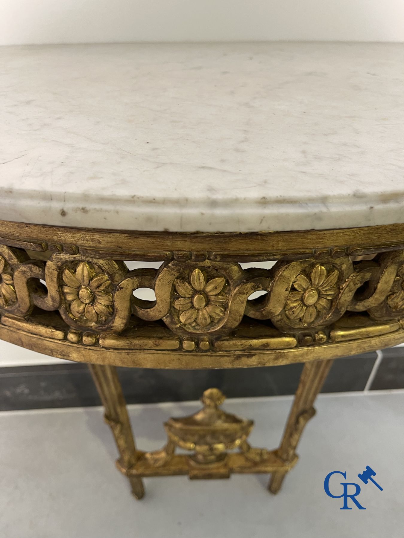 Furniture: Wood sculpted and gilded crescent shaped console. LXVI-period.