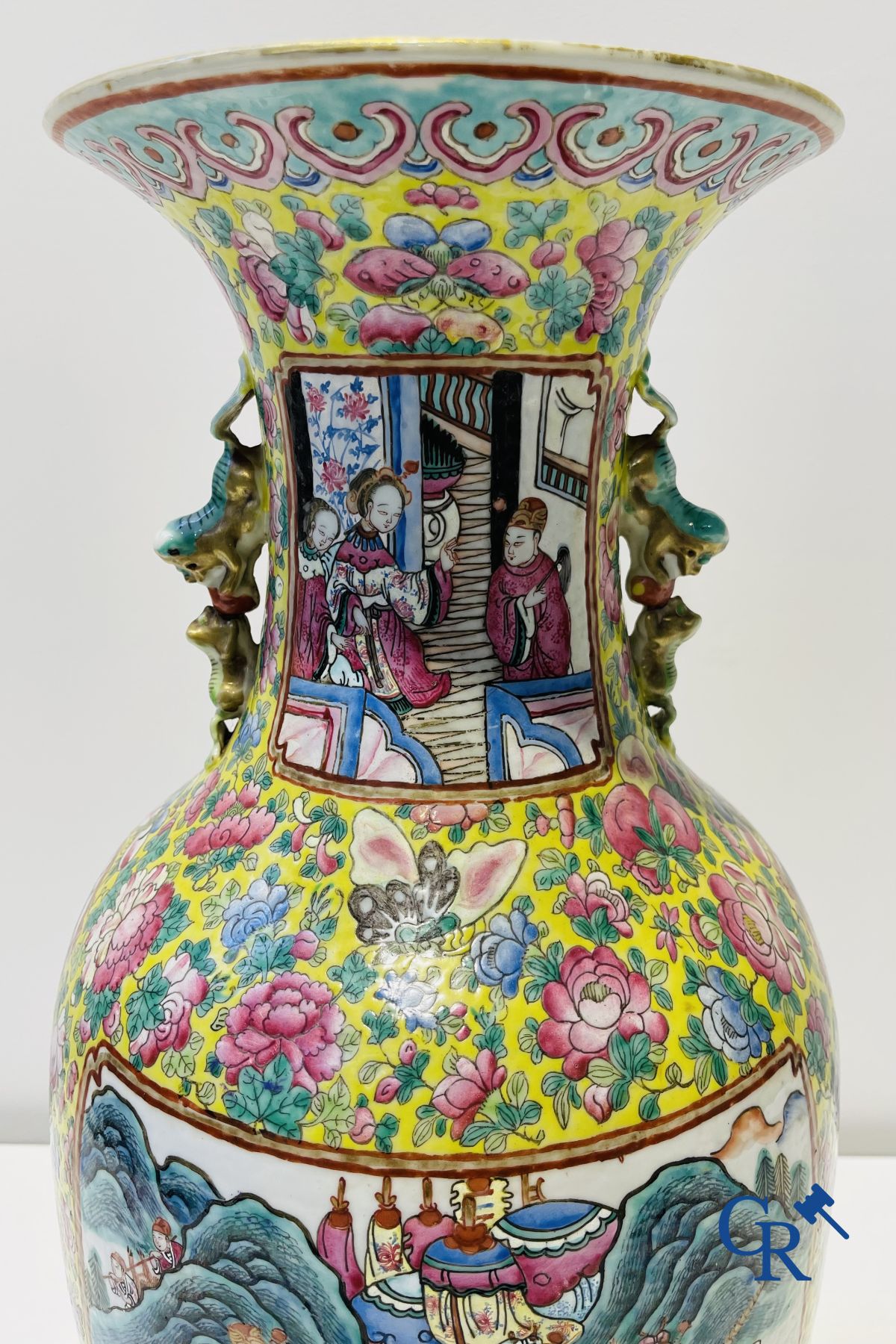 Asian art: A pair of Chinese famille rose vases with yellow background with court scenes. 19th century.