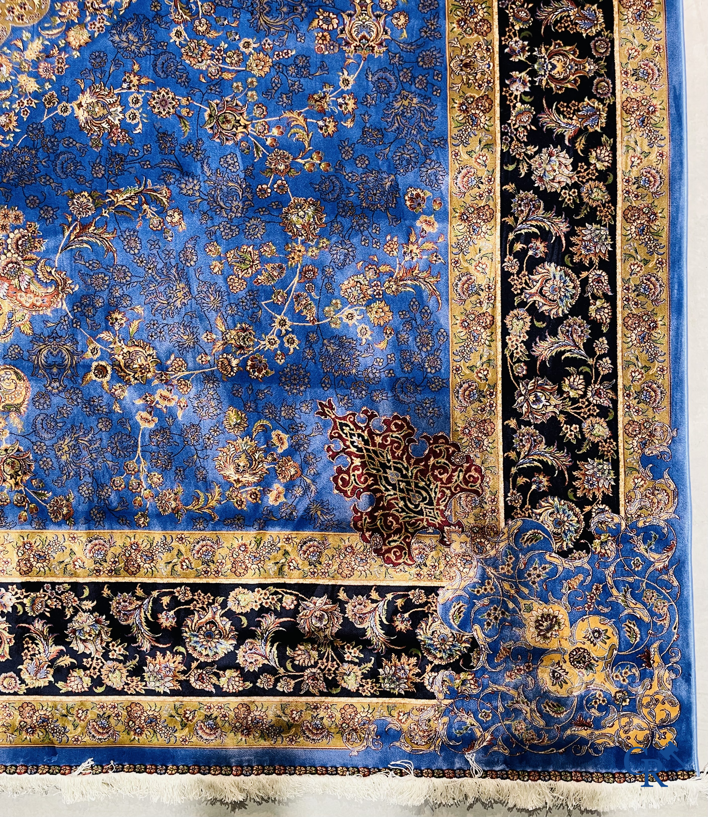 Carpets. Exceptional silk carpet with floral decor on a blue background.