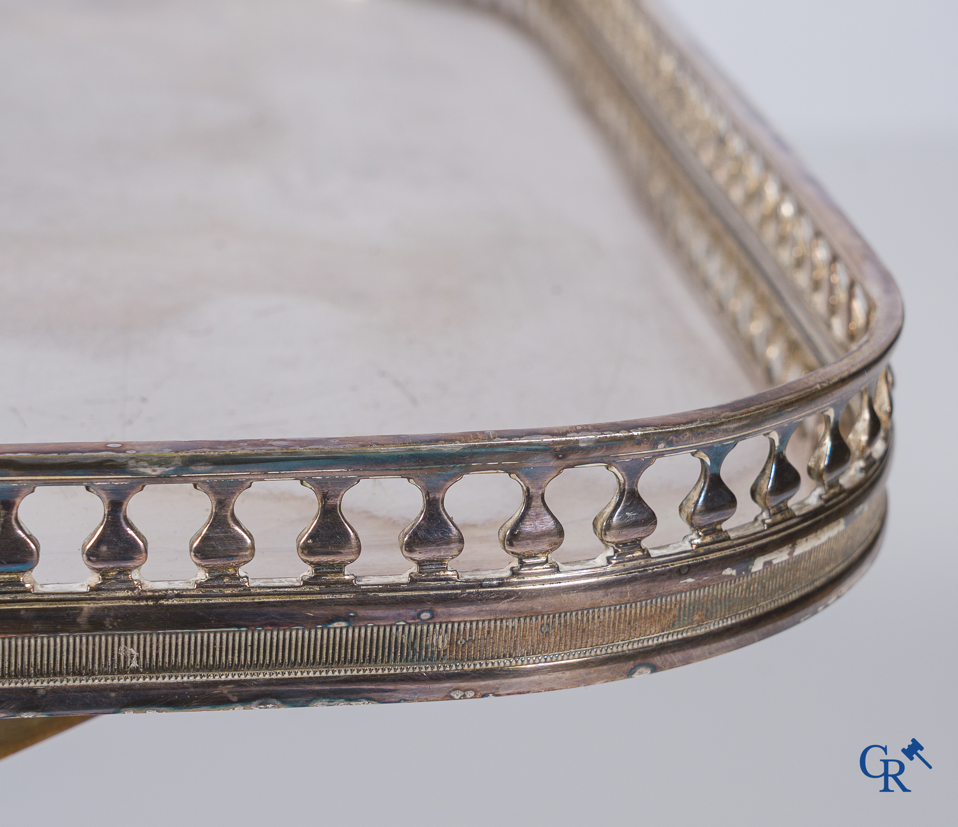 Side table in silver-plated brass, X-shaped legs, finished with lion legs. Around 1960.