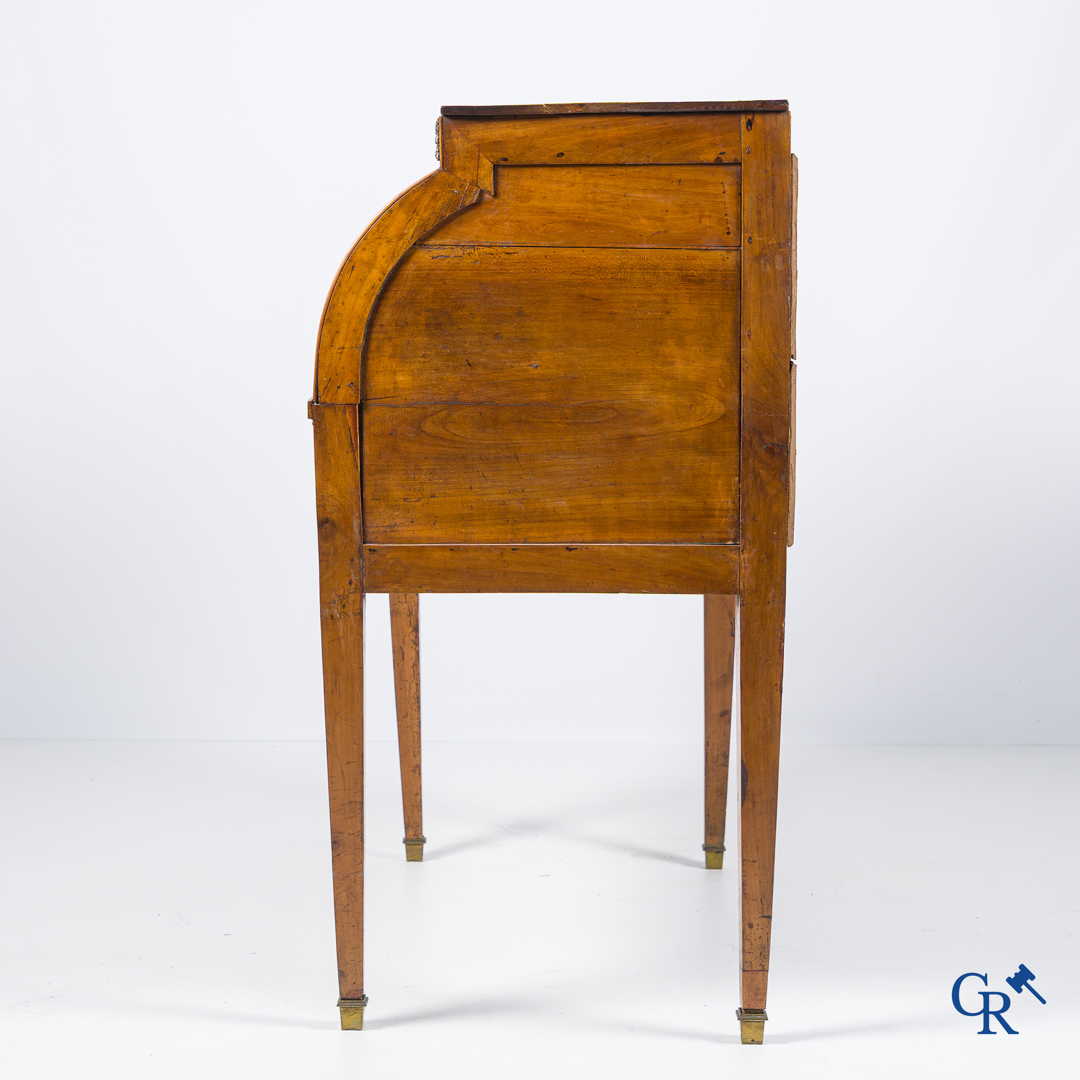 LXVI-period. A ladies cylinder desk in cherrywood and marquetry. France, end of the 18th century.