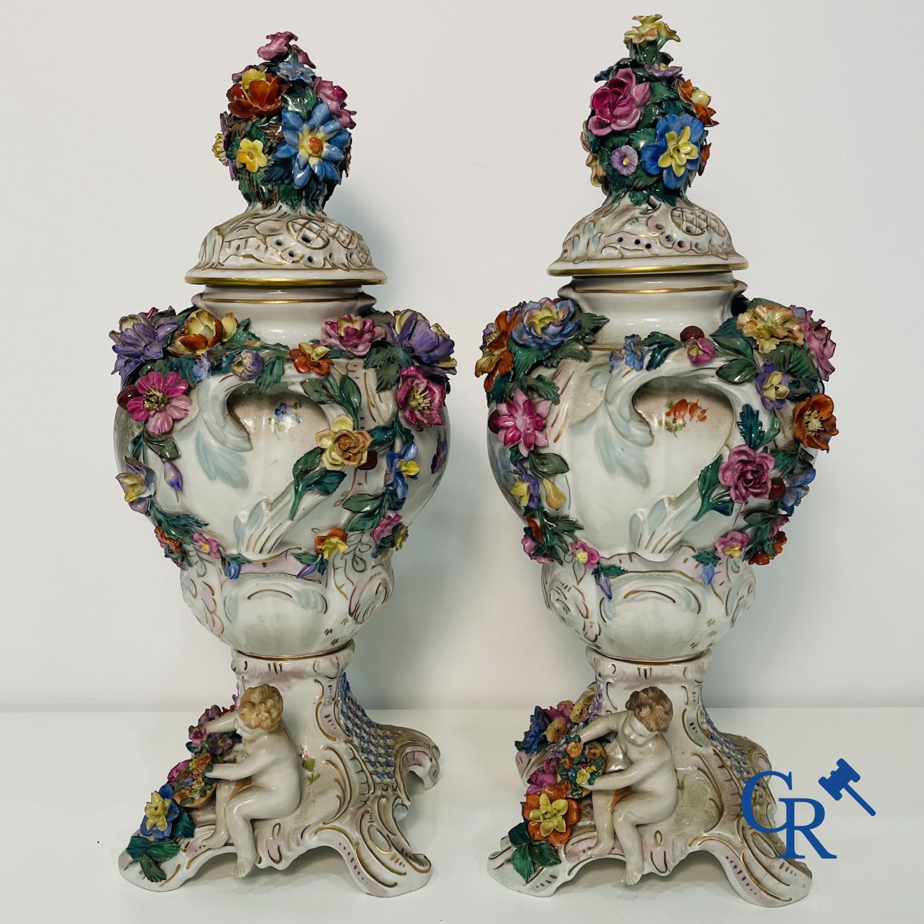 Dresden: A pair of openwork porcelain lid vases.