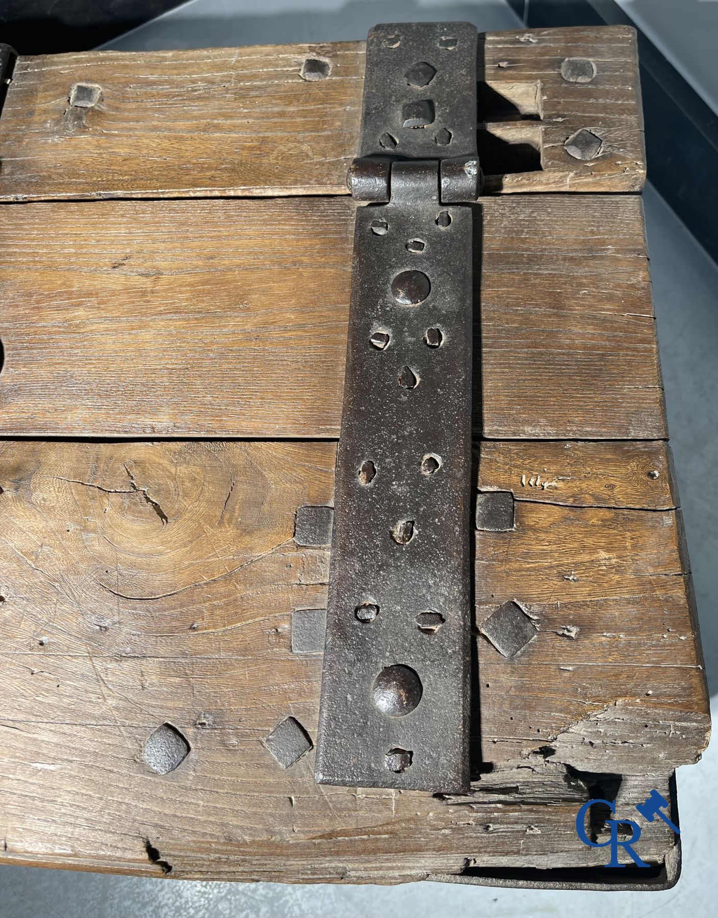 Antique wooden chest with hardware and lockwork in forging.