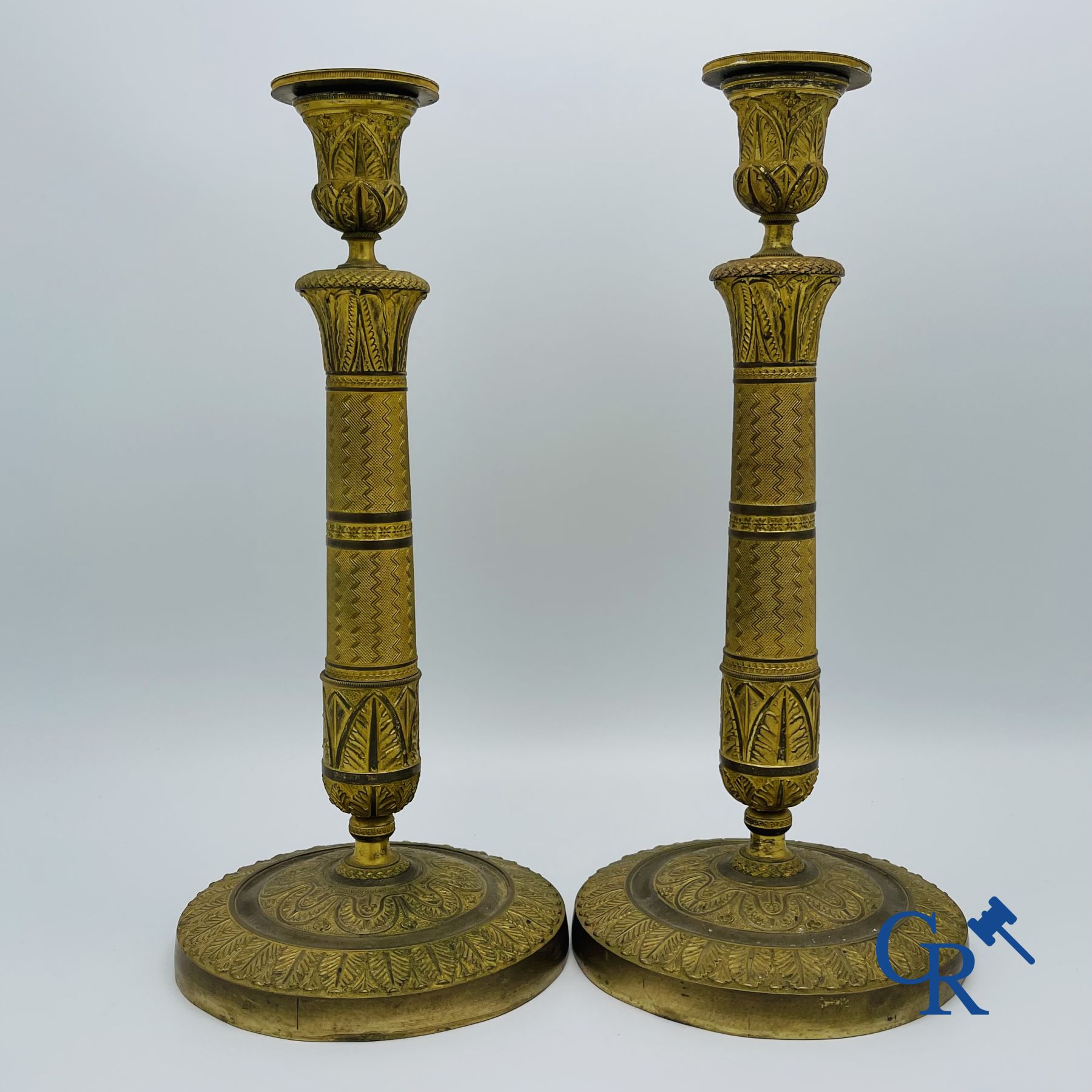 Pair of Charles X candlesticks in gilded bronze.