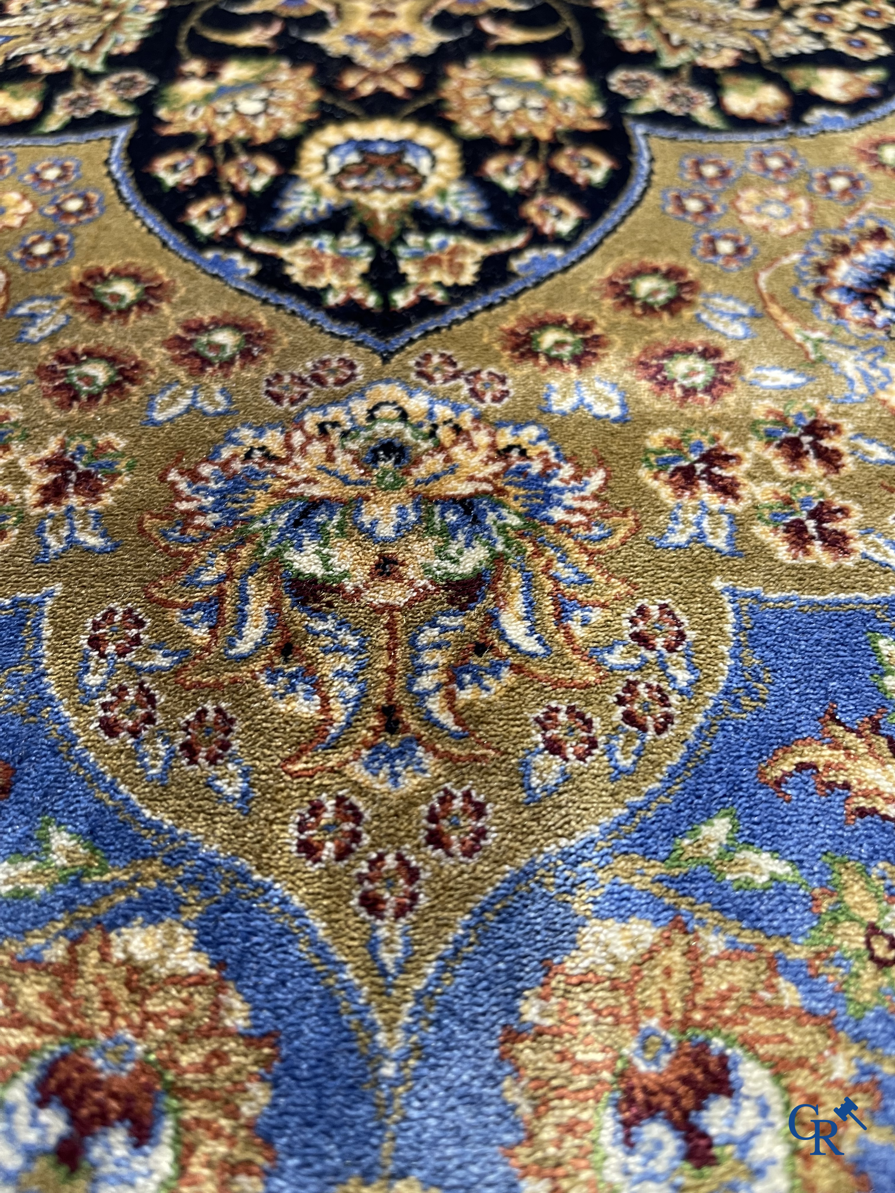 Carpets. Exceptional silk carpet with floral decor on a blue background.