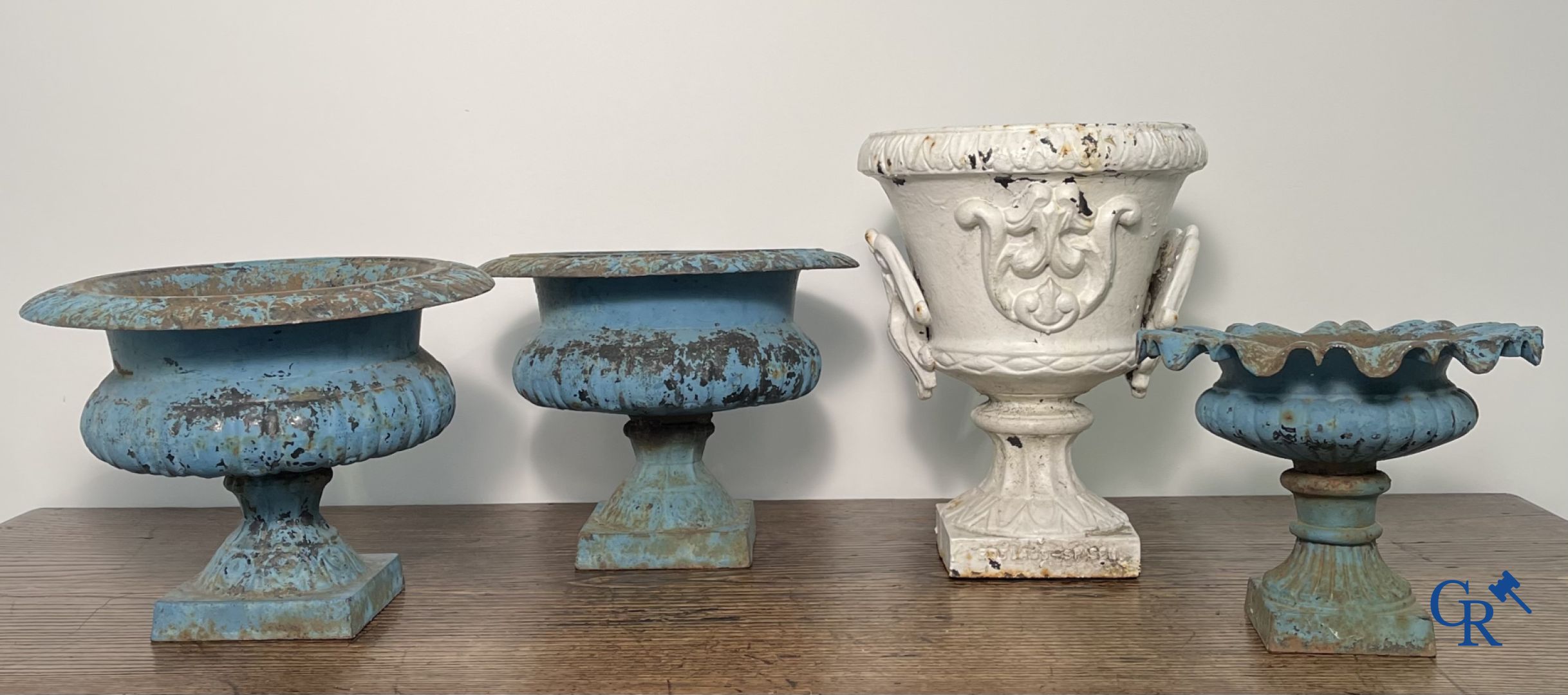 4 cast iron garden vases.