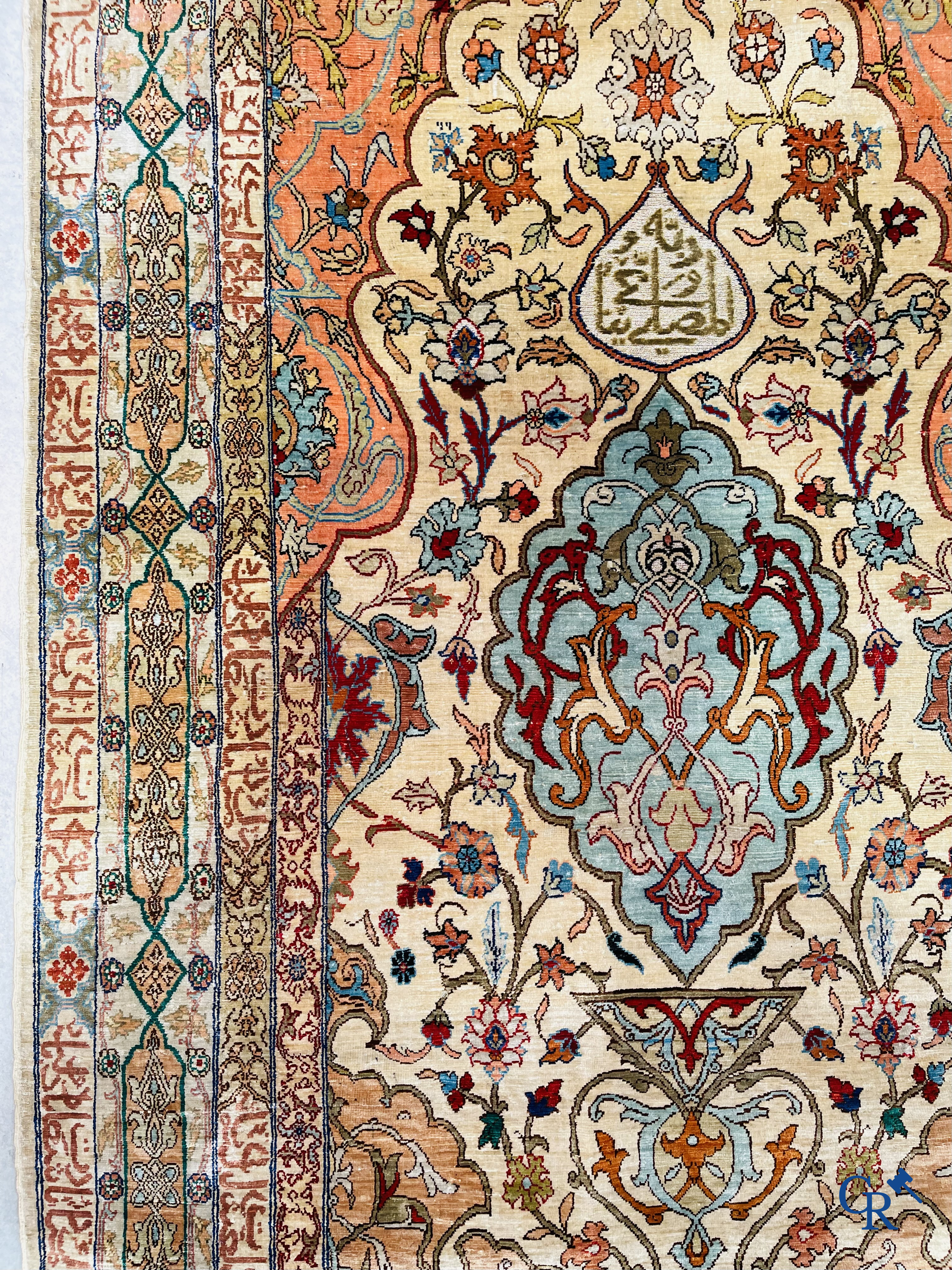 Oriental carpets, Hereke Turkey, a finely hand-knotted silk carpet with inscriptions and gold thread.