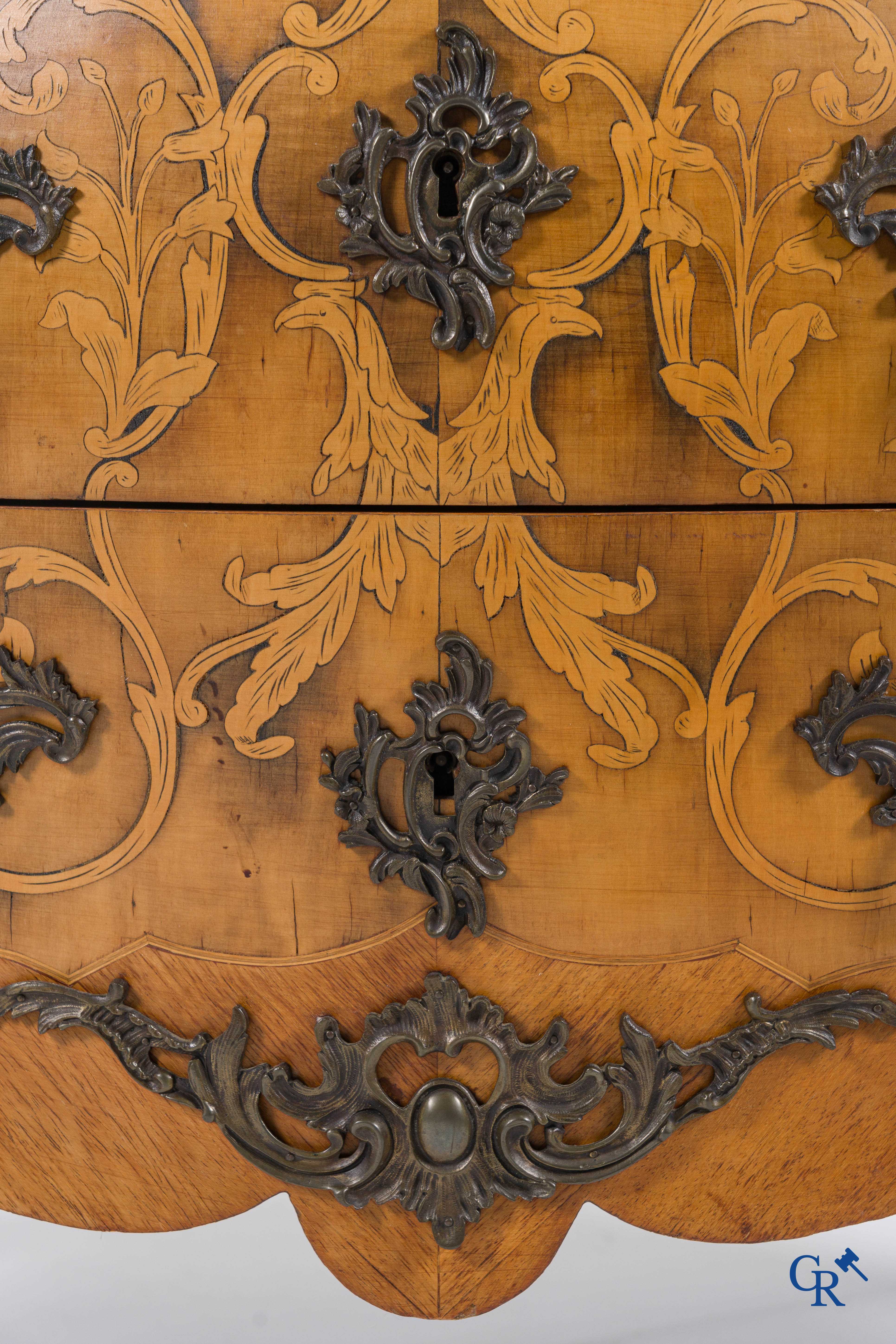 A marquetry chest of drawers and bronze fittings with a marble tablet. LXV style.