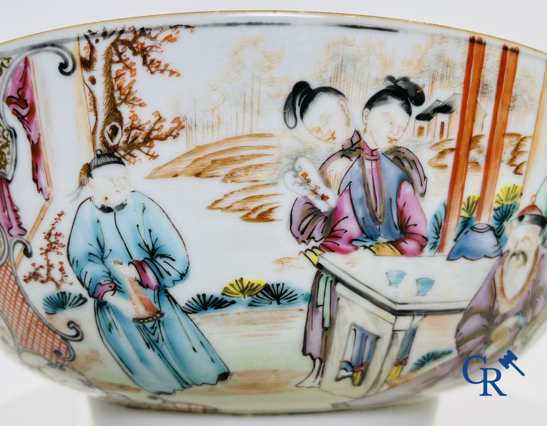 Un grand bol chinois decor mandarin en famille rose, une tasse et soucoupe en famille rose et une figurine en blanc de chine.