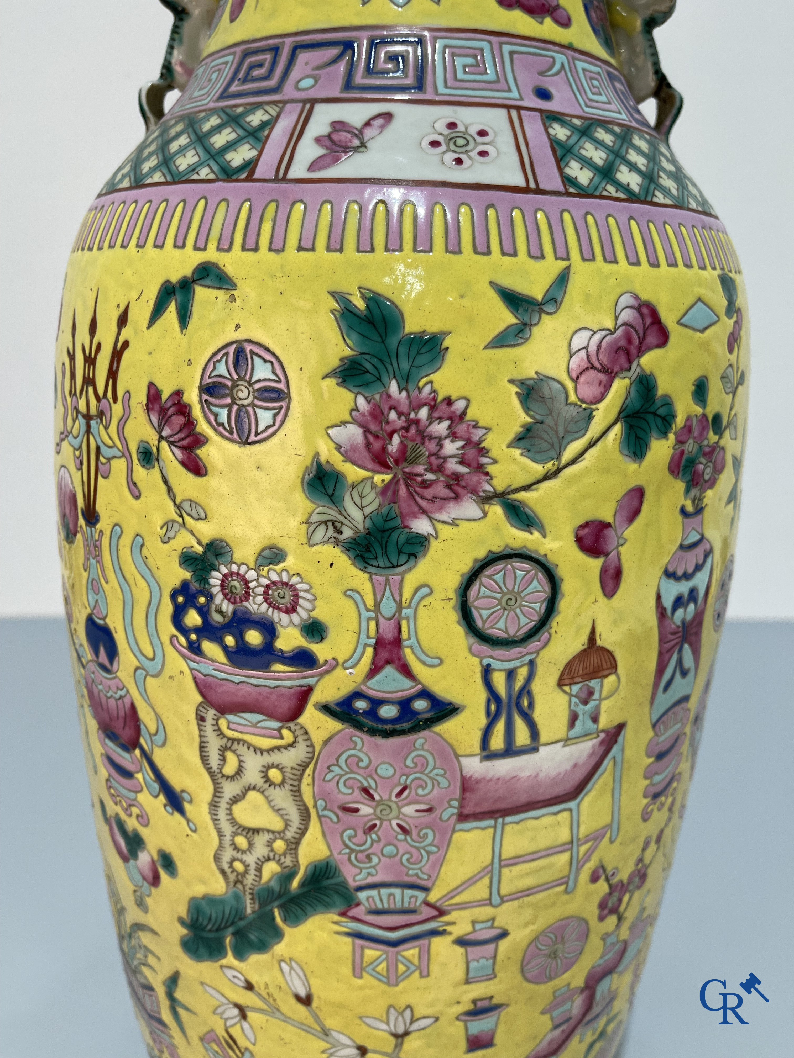 Asian Art, Chinese porcelain, a large Chinese famille jaune and rose vase with a decor of antiques. 19th century.