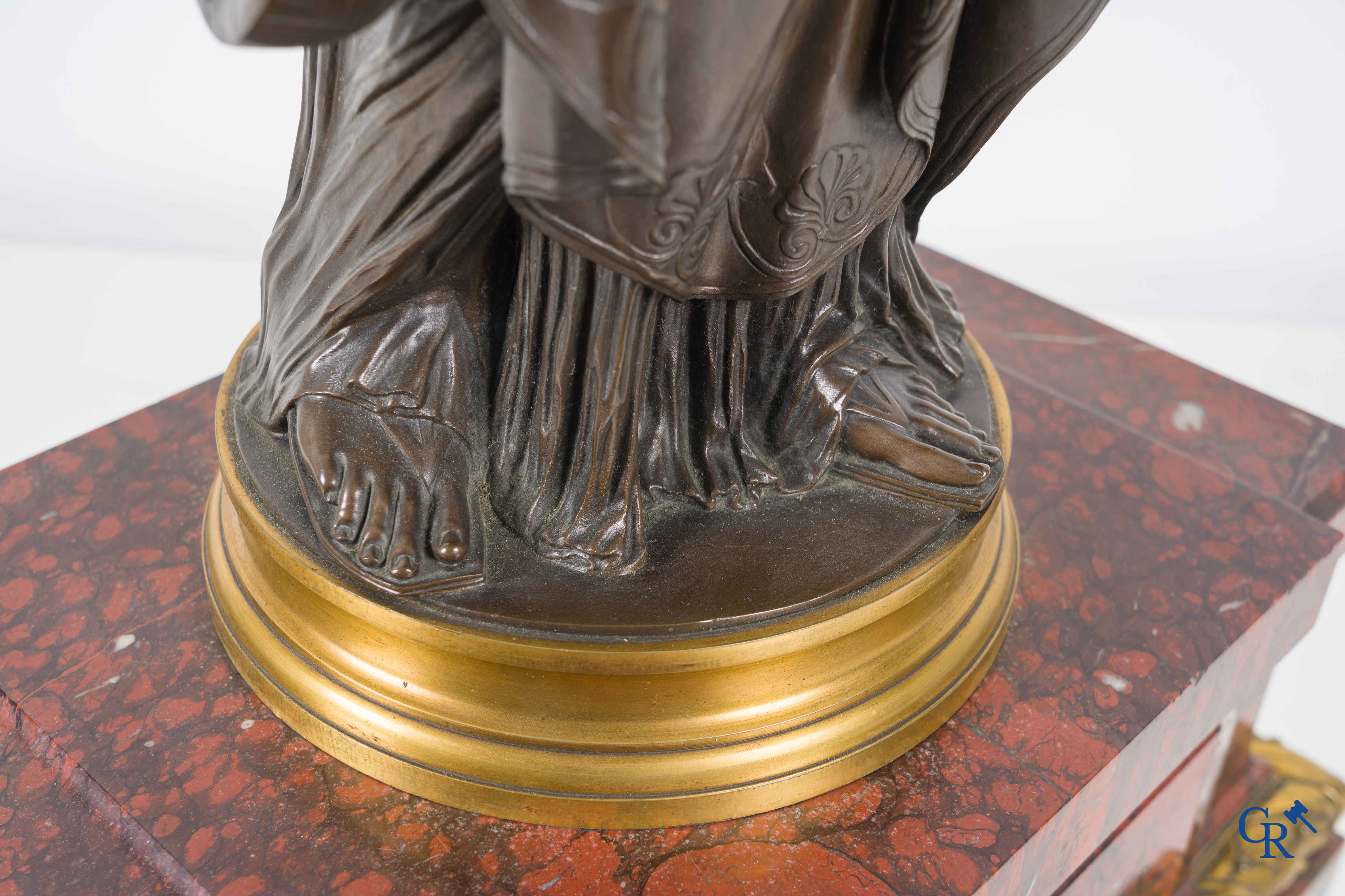 F. Barbedienne Fondeur, a bronze statue in the antique style with brown patina and gilding on a marble pedestal.