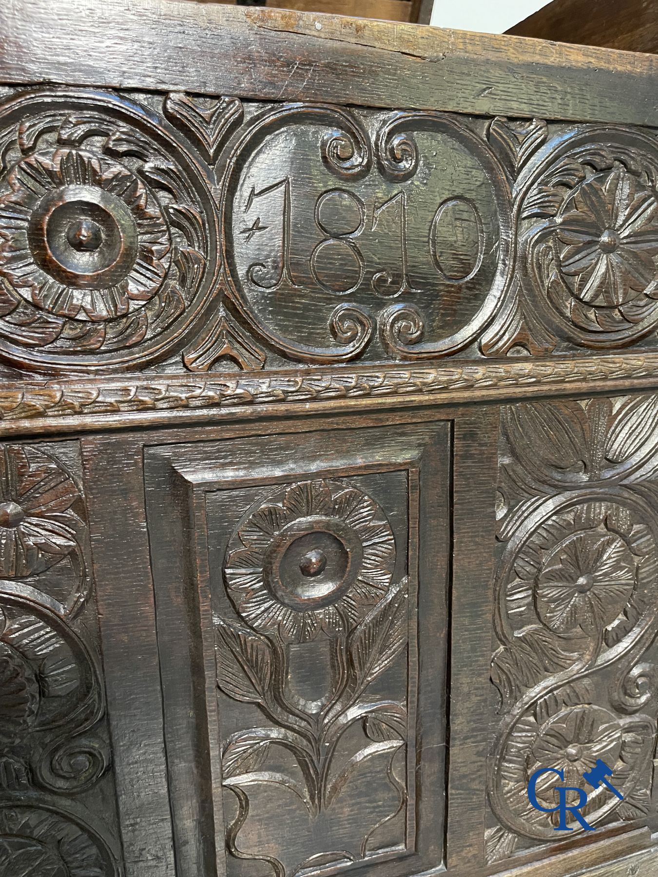 Furniture: Large sculpted oak chest. England, dated 1810.