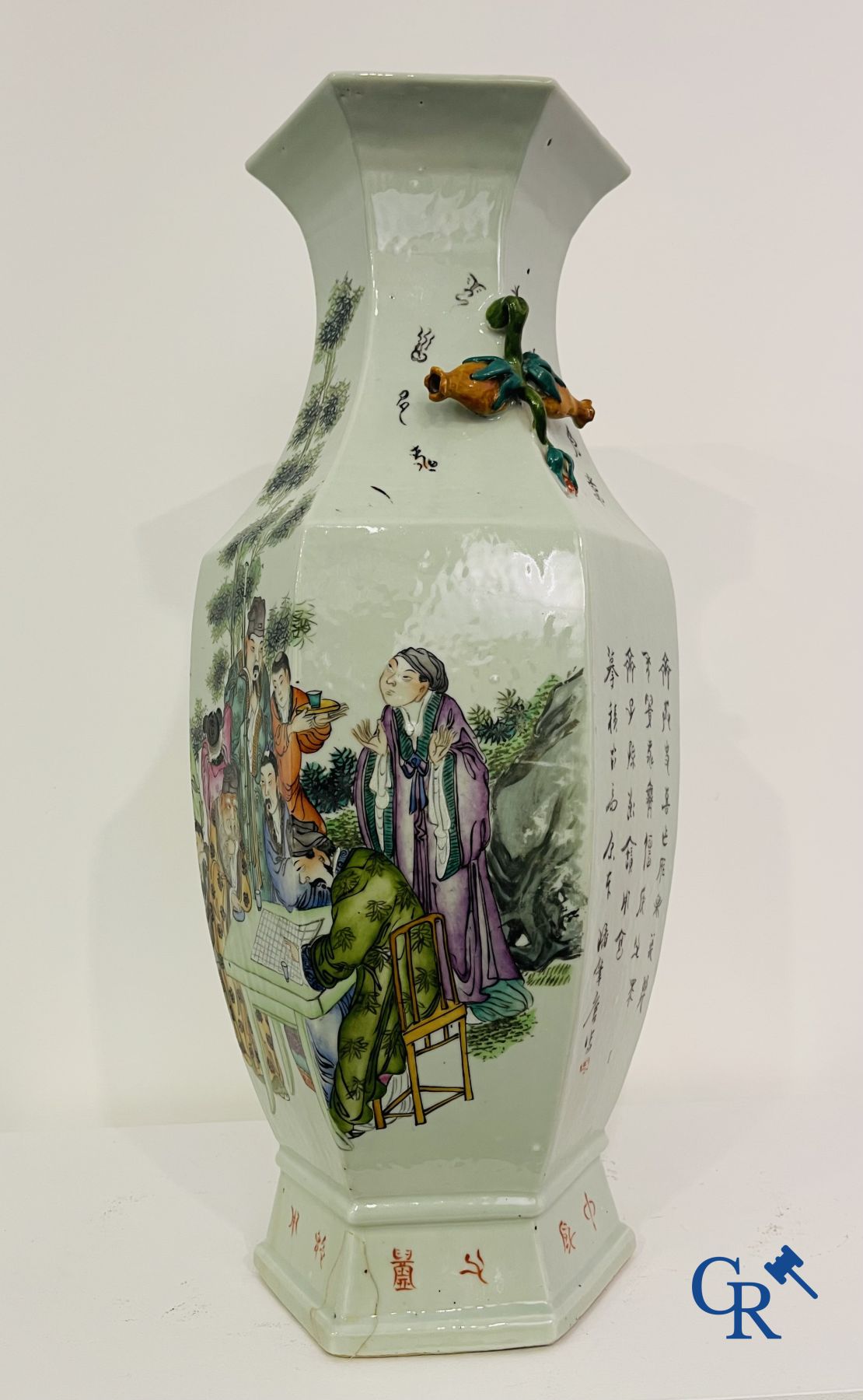 Asian Art: Chinese porcelain. A hexagonal Chinese Famille rose vase with sages and scholars. 19/20th century.