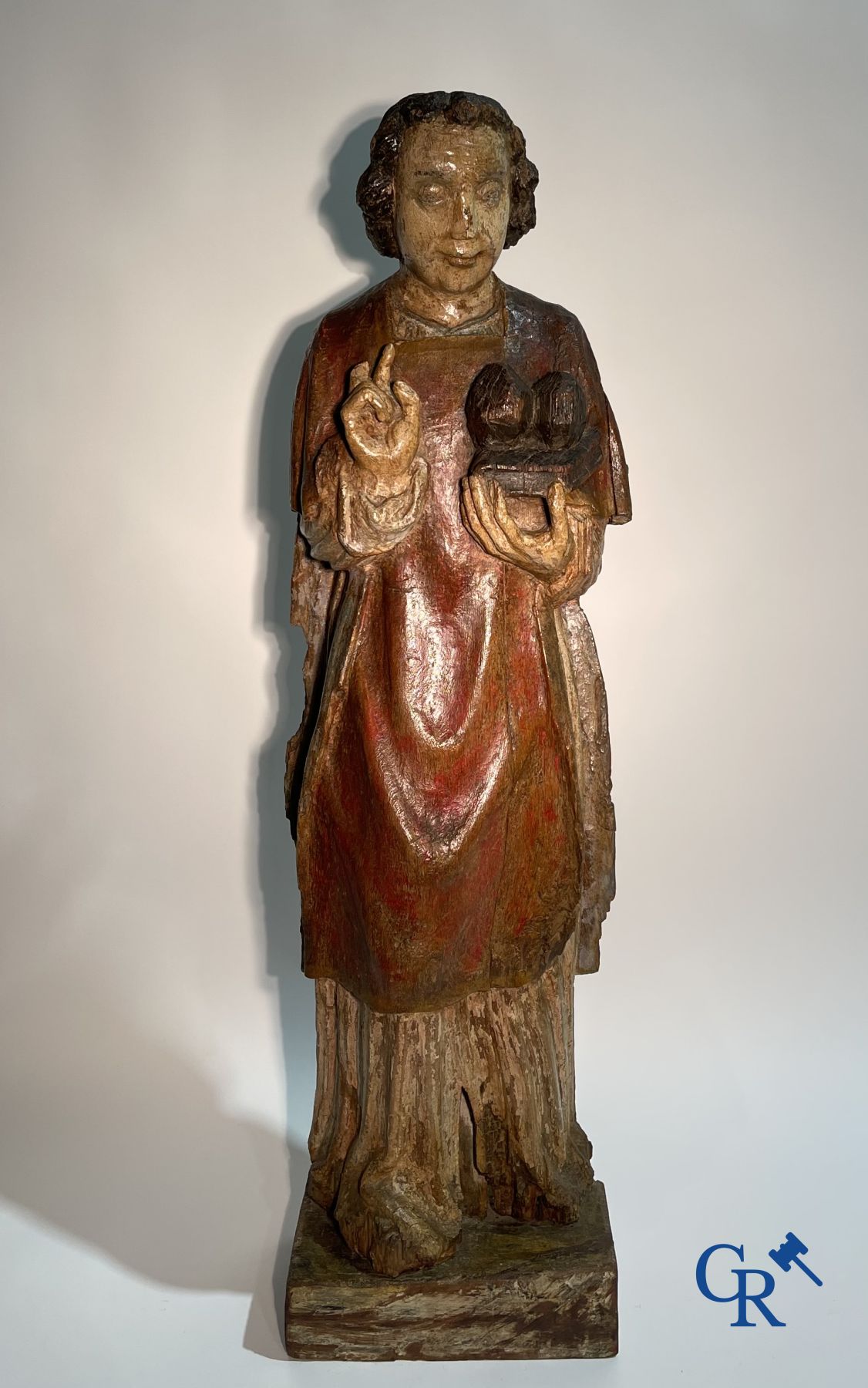 Wooden sculpture: Polychrome wood sculpture of a saint. Saint Stephen. Probably 17th century.