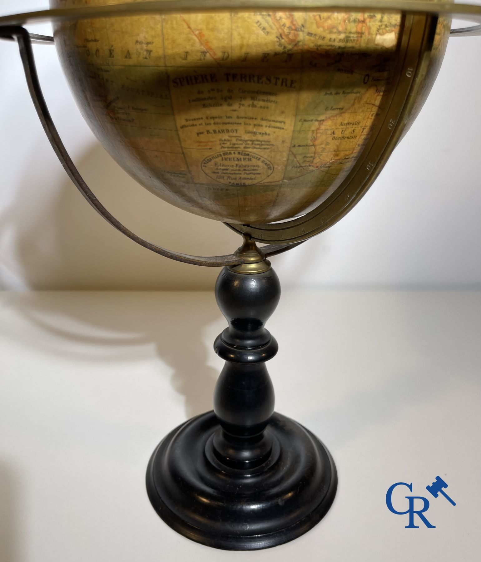 An antique globe with meridian circle on a black lacquered wooden base. 19th century.