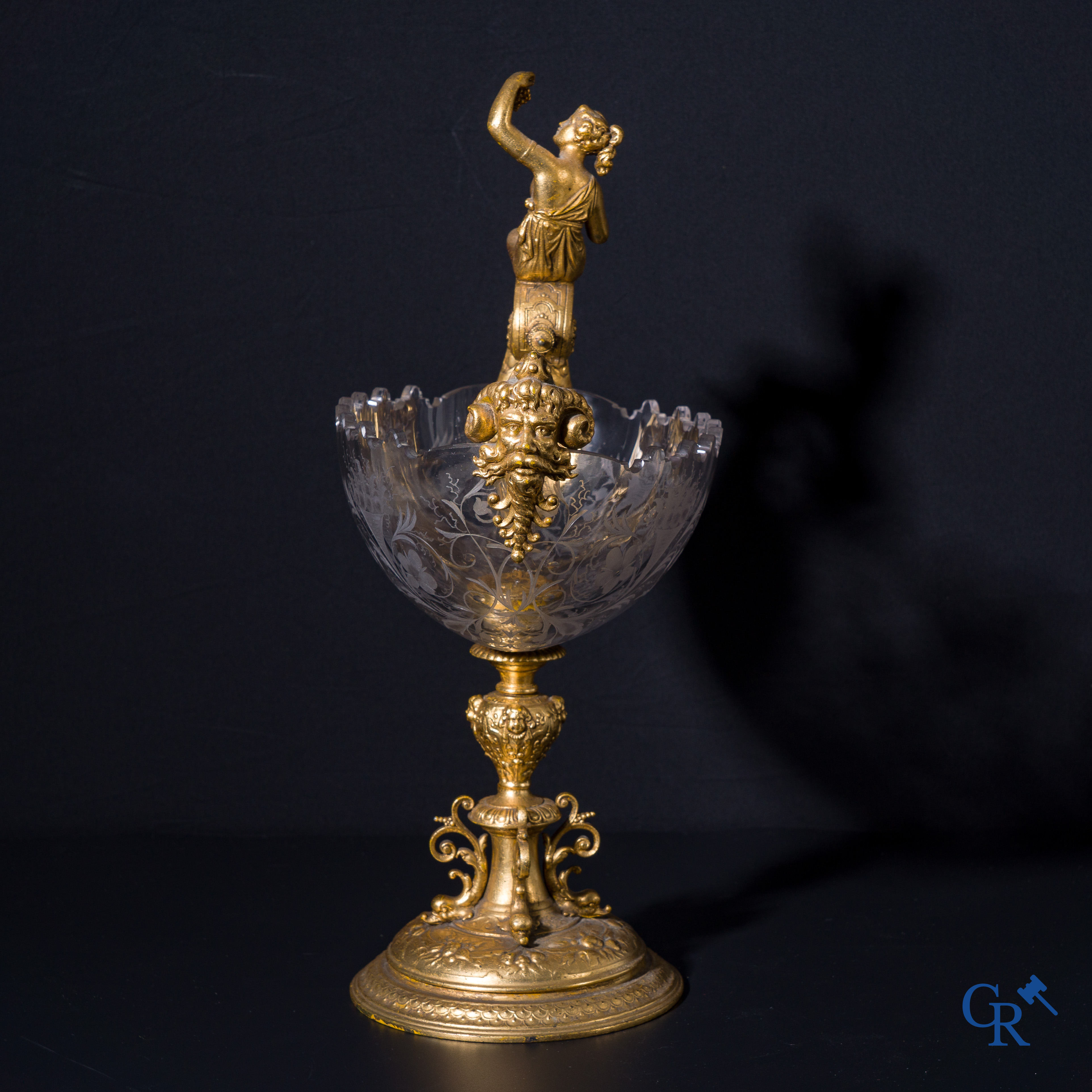 A gilded Renaissance-style table centerpiece with a richly cut crystal coupe. Late 19th century.