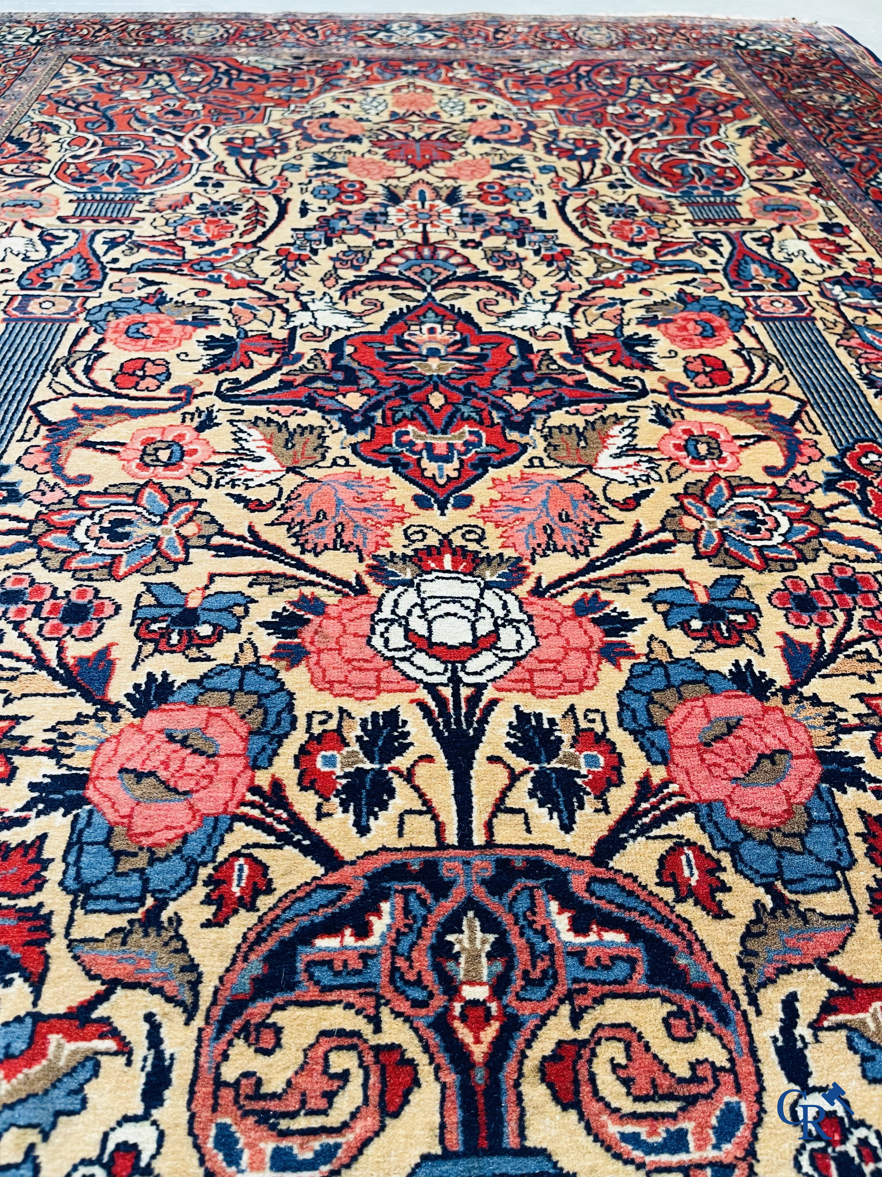 Oriental carpets: Iran. 2 antique hand-knotted Persian carpets with floral decor.