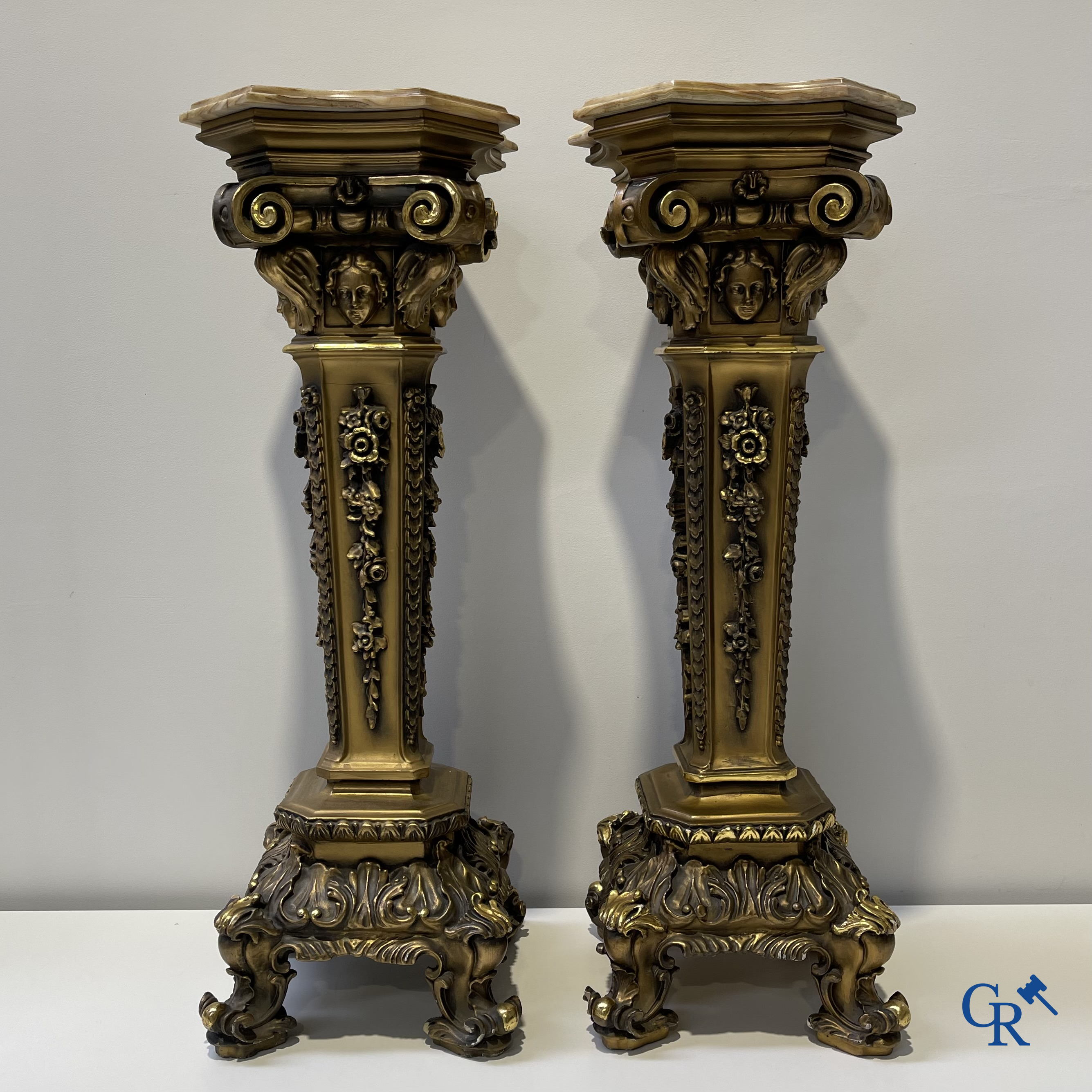 Pair of decorative gilded pedestals with onix top.