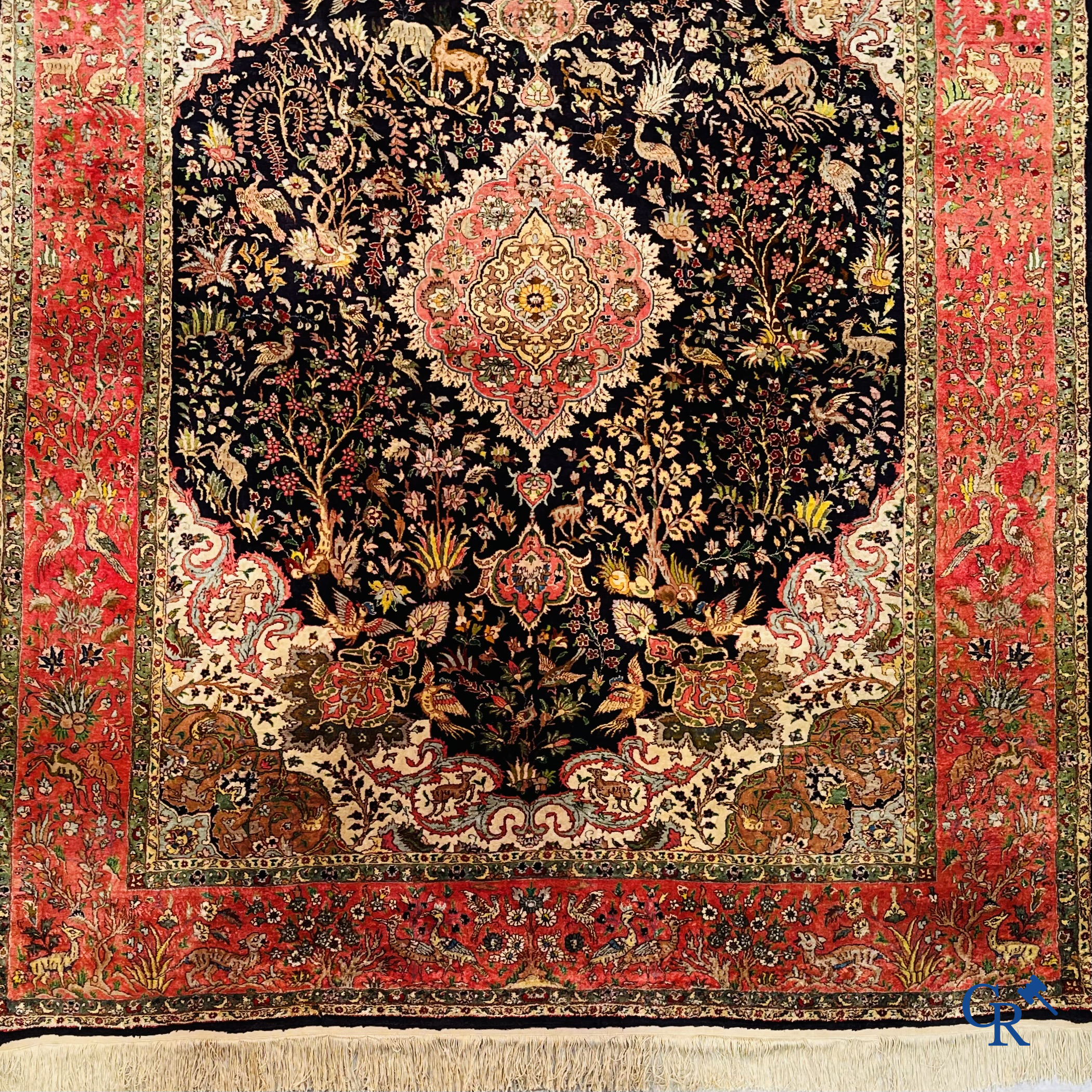 Oriental carpets: Tabriz, a finely hand-knotted silk carpet with forest animals and birds in a floral decor.