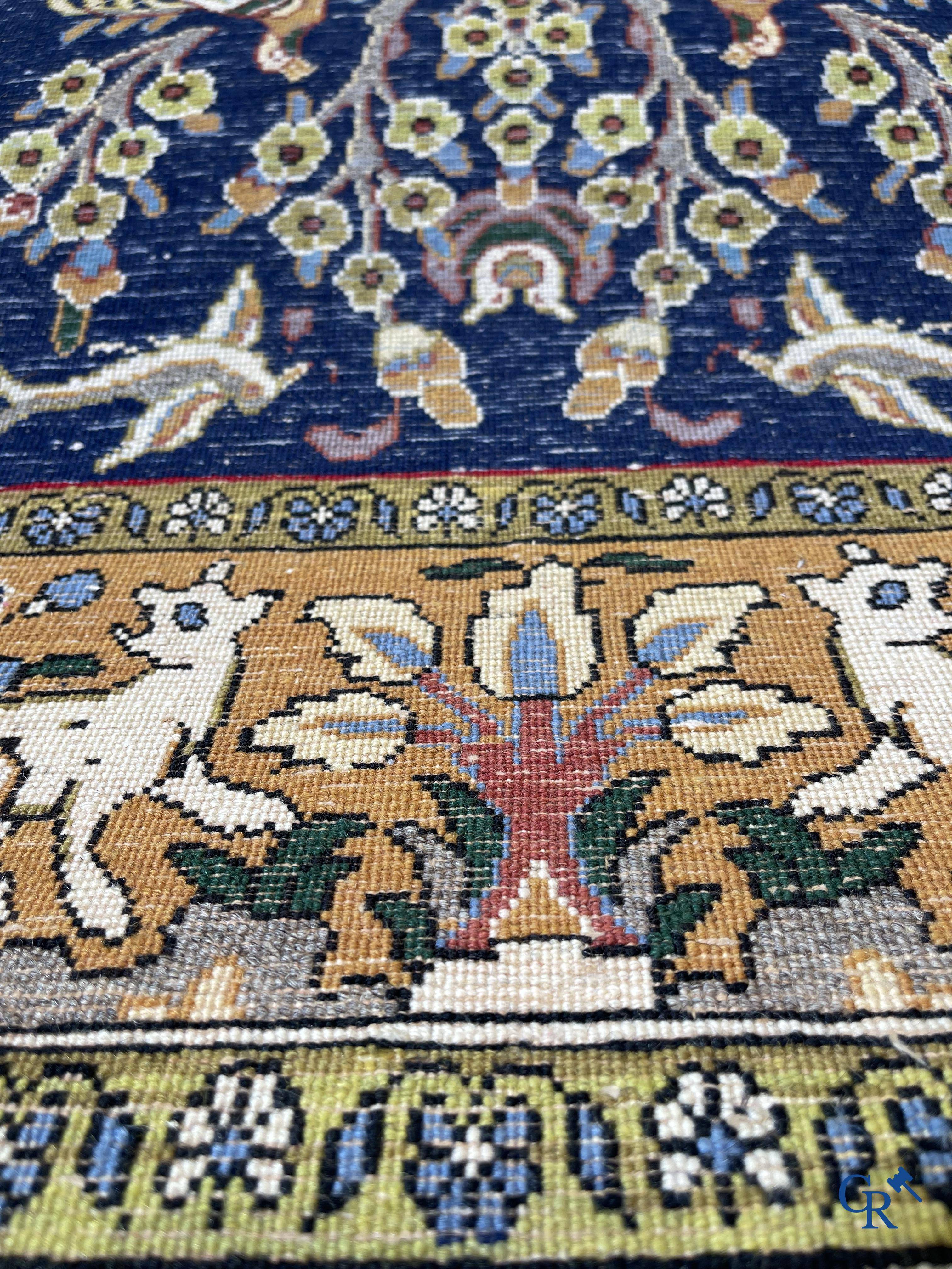 Oriental carpets: Iran, hand-knotted Persian carpet with decor of forest animals.