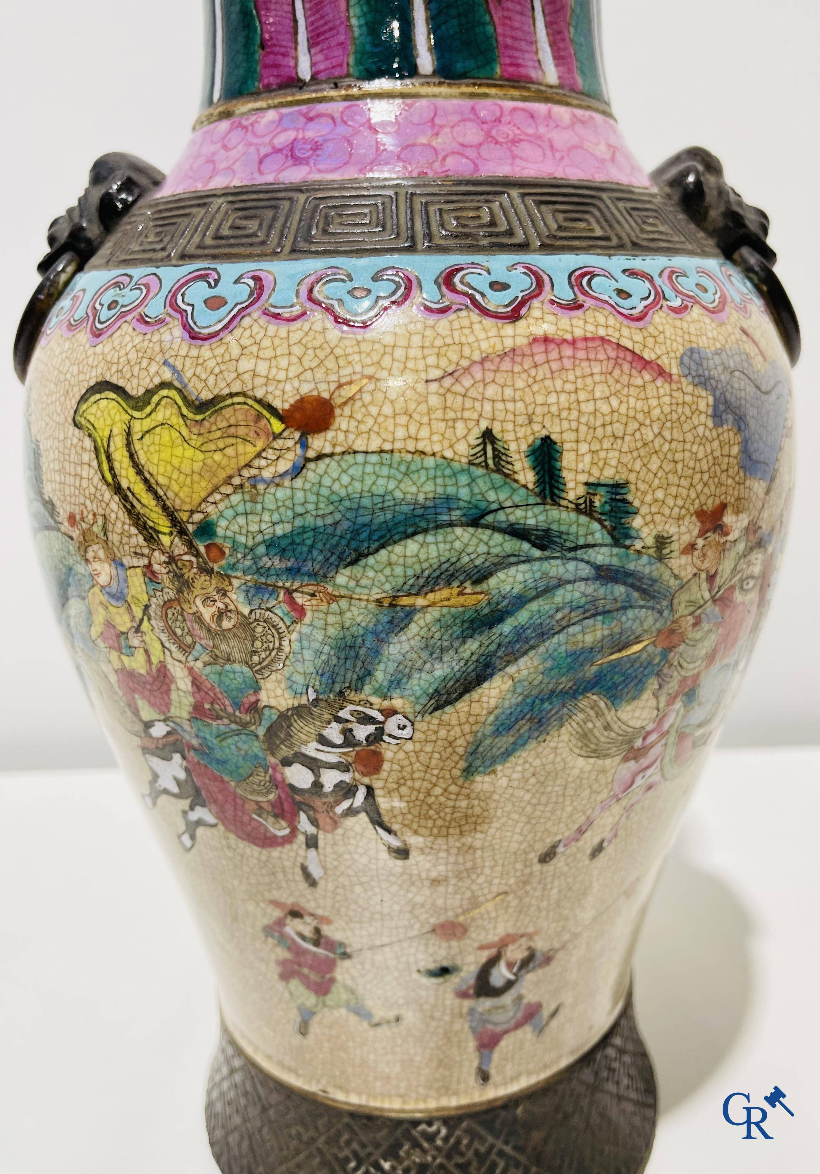 Asian art: A Chinese Nanking famille rose crackle vase with warrior decor. 19th century.