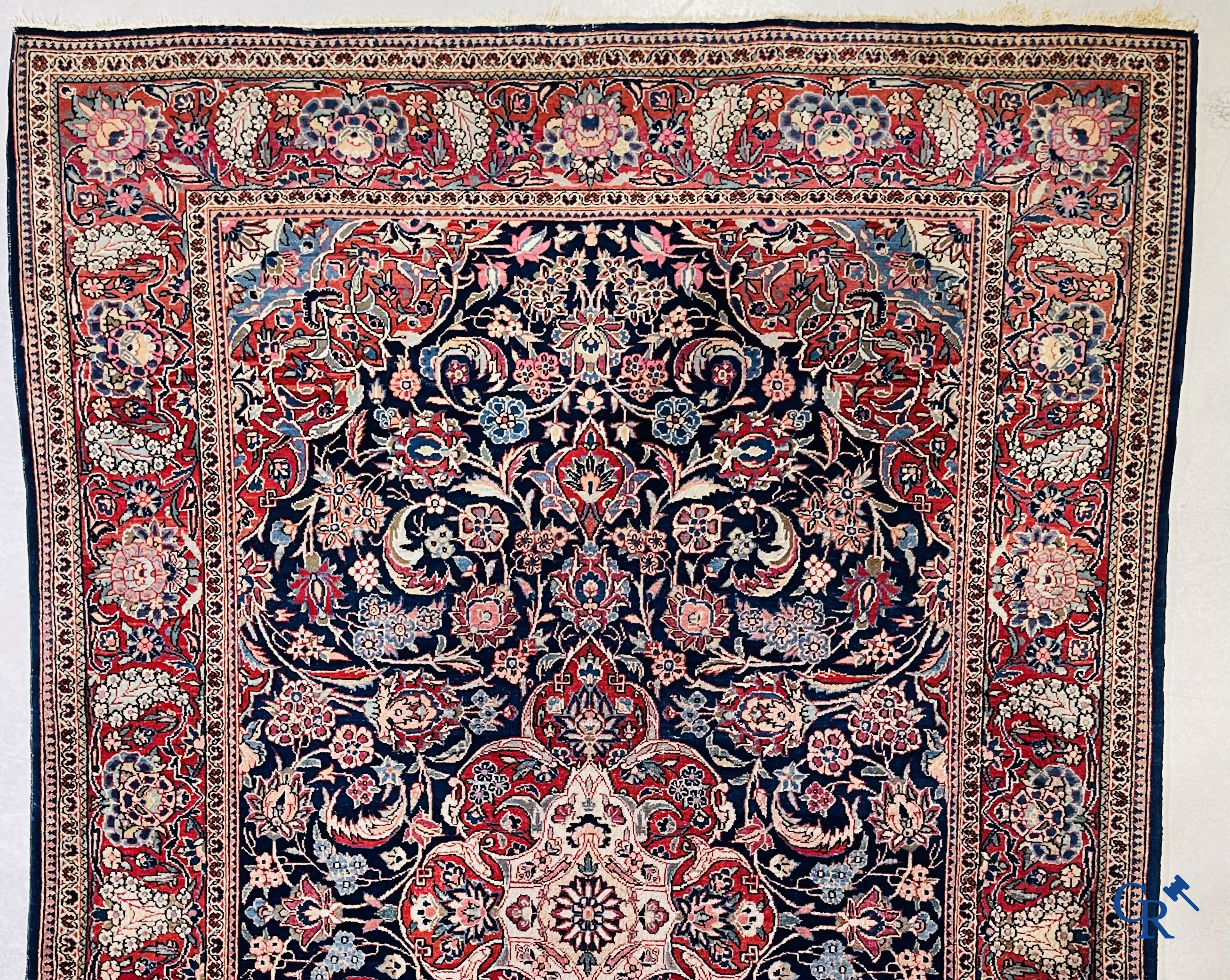 Oriental carpets: Iran. 2 antique hand-knotted Persian carpets with floral decor.