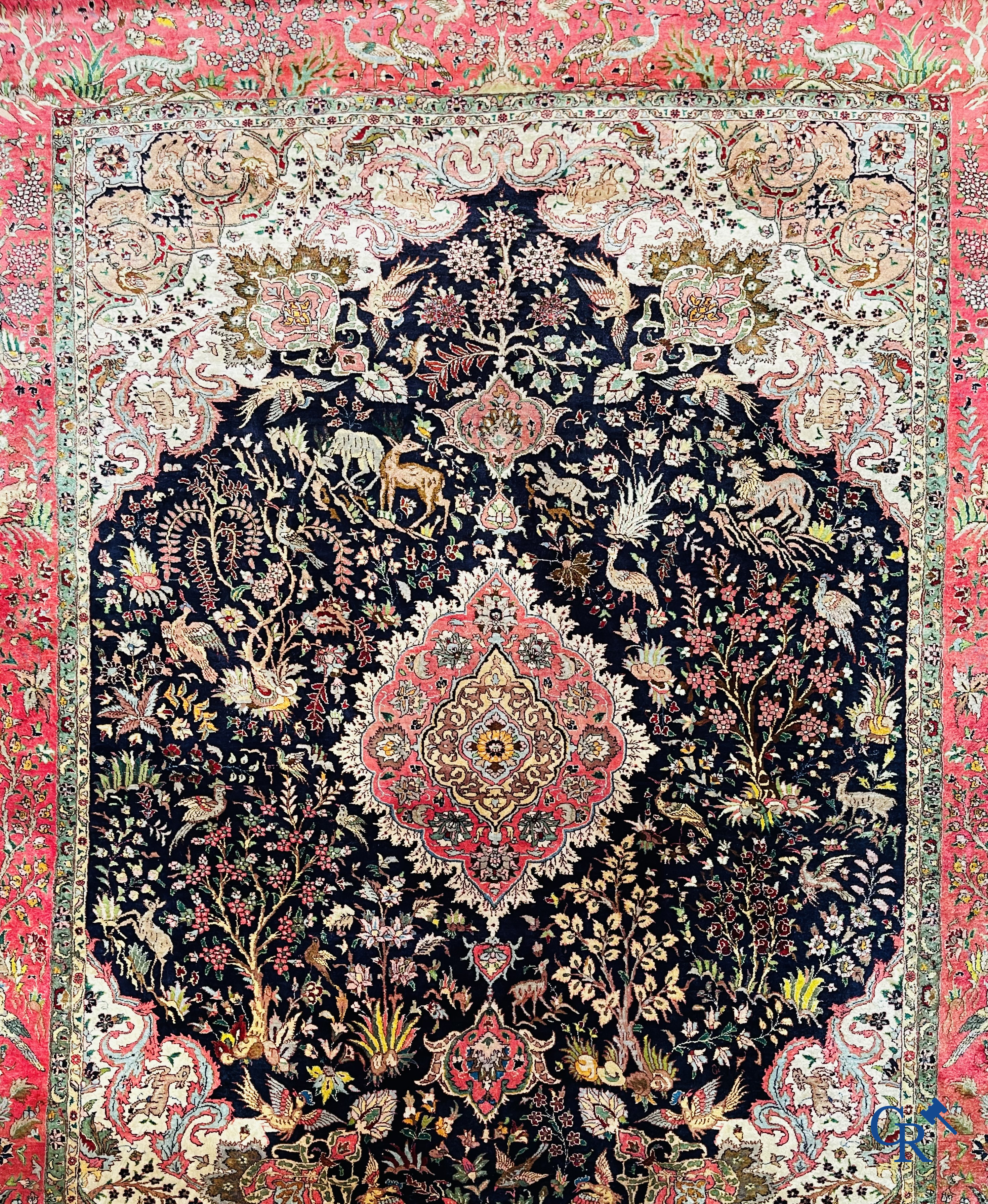 Oriental carpets: Tabriz, a finely hand-knotted silk carpet with forest animals and birds in a floral decor.