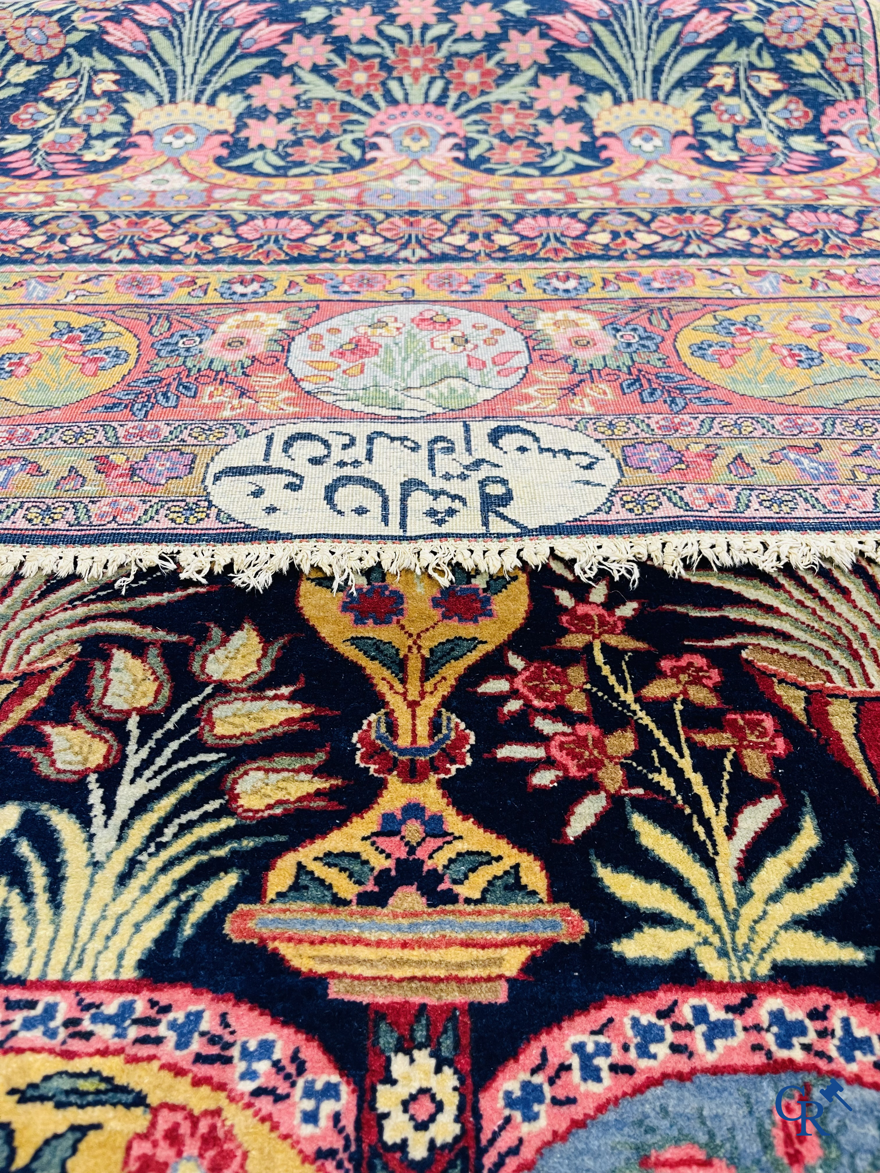 Oriental carpets: A finely knotted Oriental carpet with floral decor. Signed.