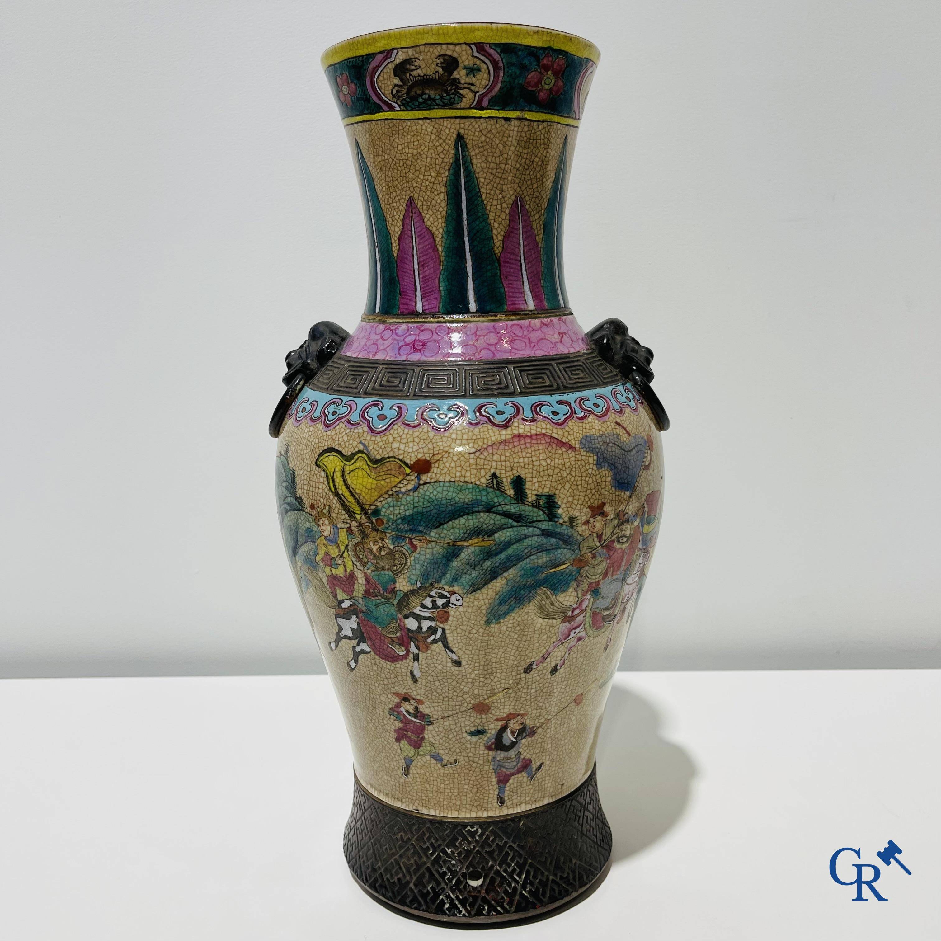 Asian art: A Chinese Nanking famille rose crackle vase with warrior decor. 19th century.